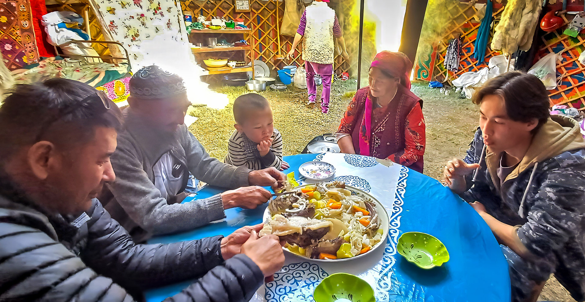 Sharing a communal bowl all using our hands to eat