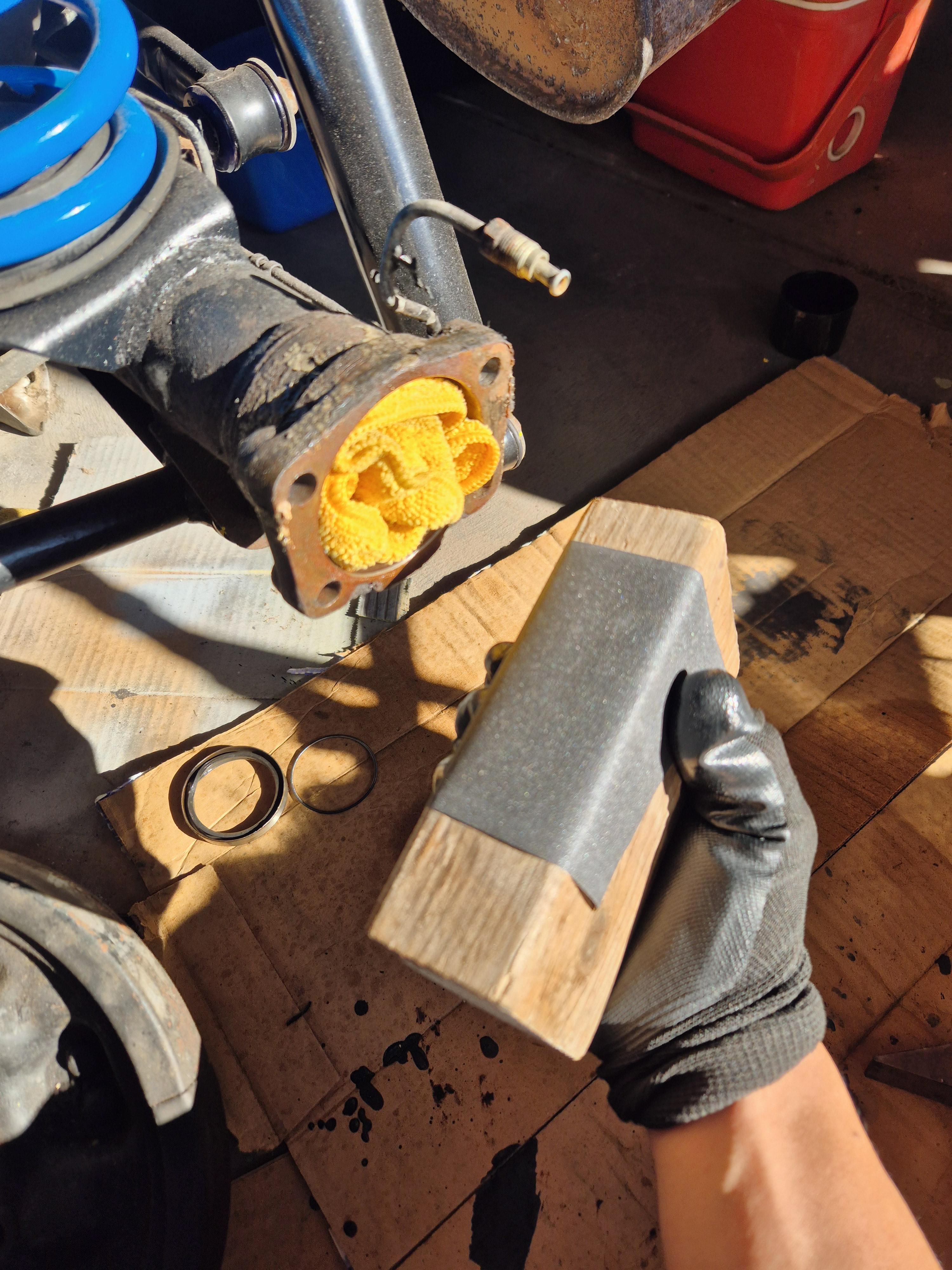 400 Grit surface refinish in preperation for Gasket + FIPG, Thread chased axle bolts and cleaned out the bolt holes