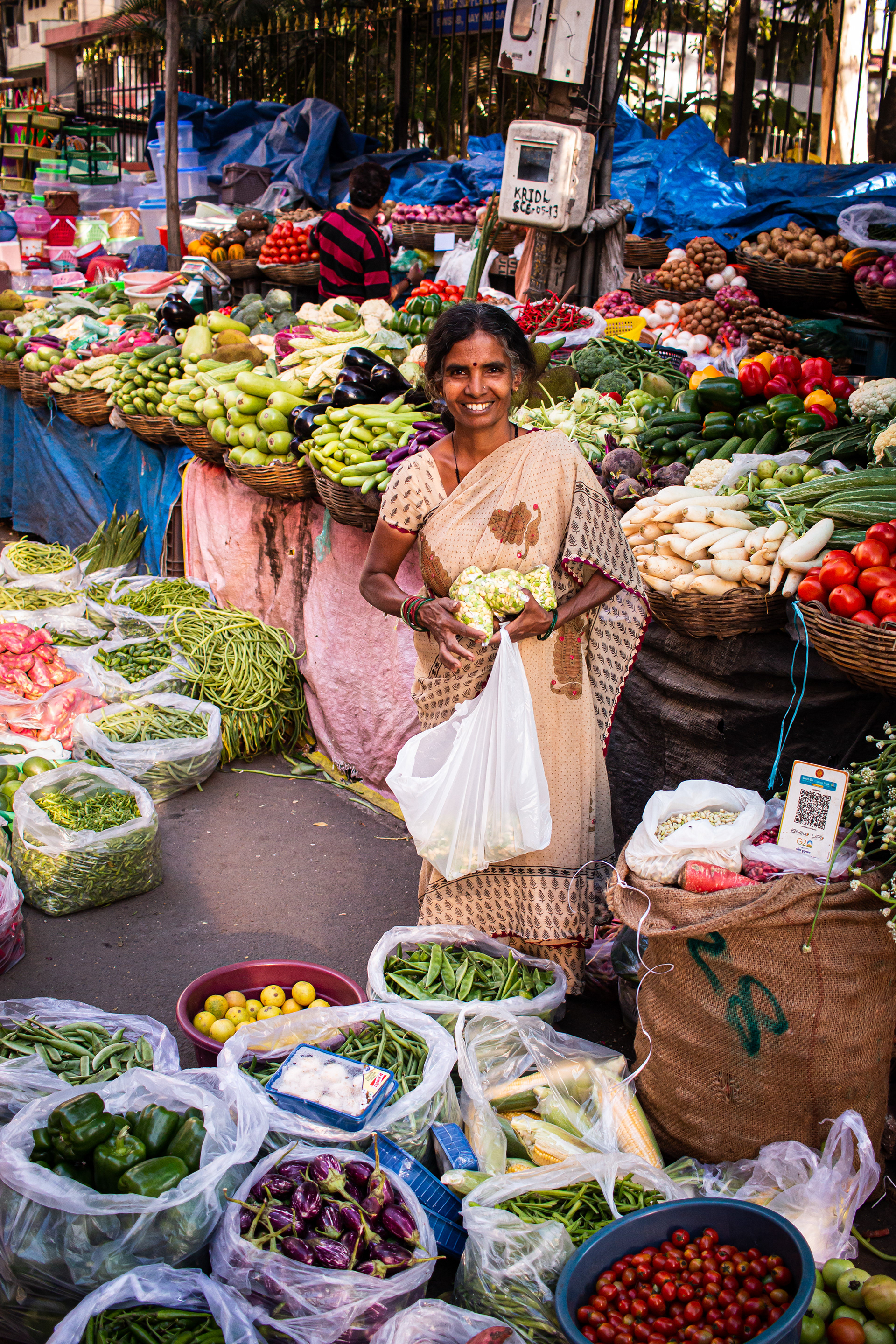 Market Scene with Smiling Woman (Bangalore, India, 2025)