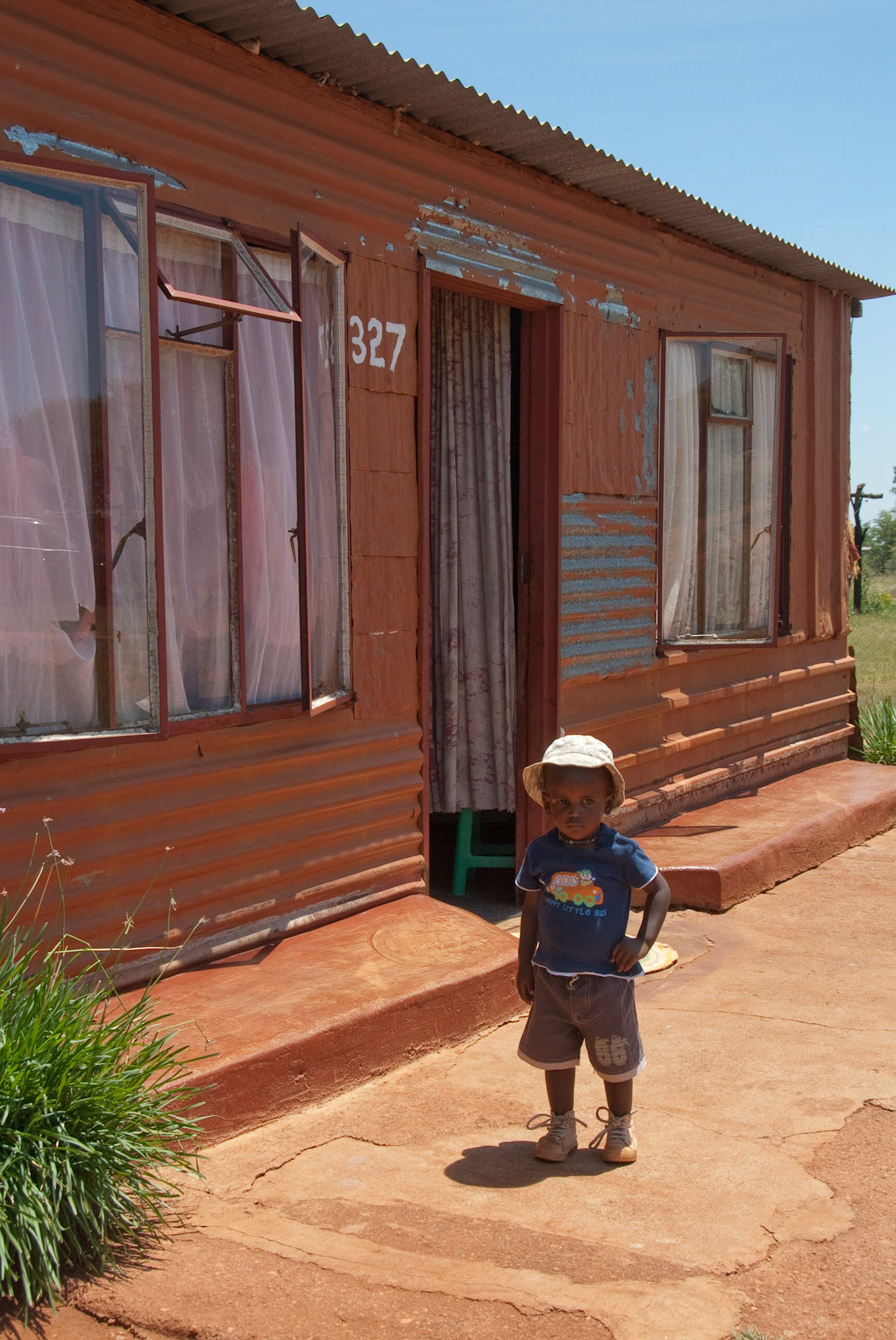 Math whizz kid, Jacob Selo Kumalo's younger brother outside their home.