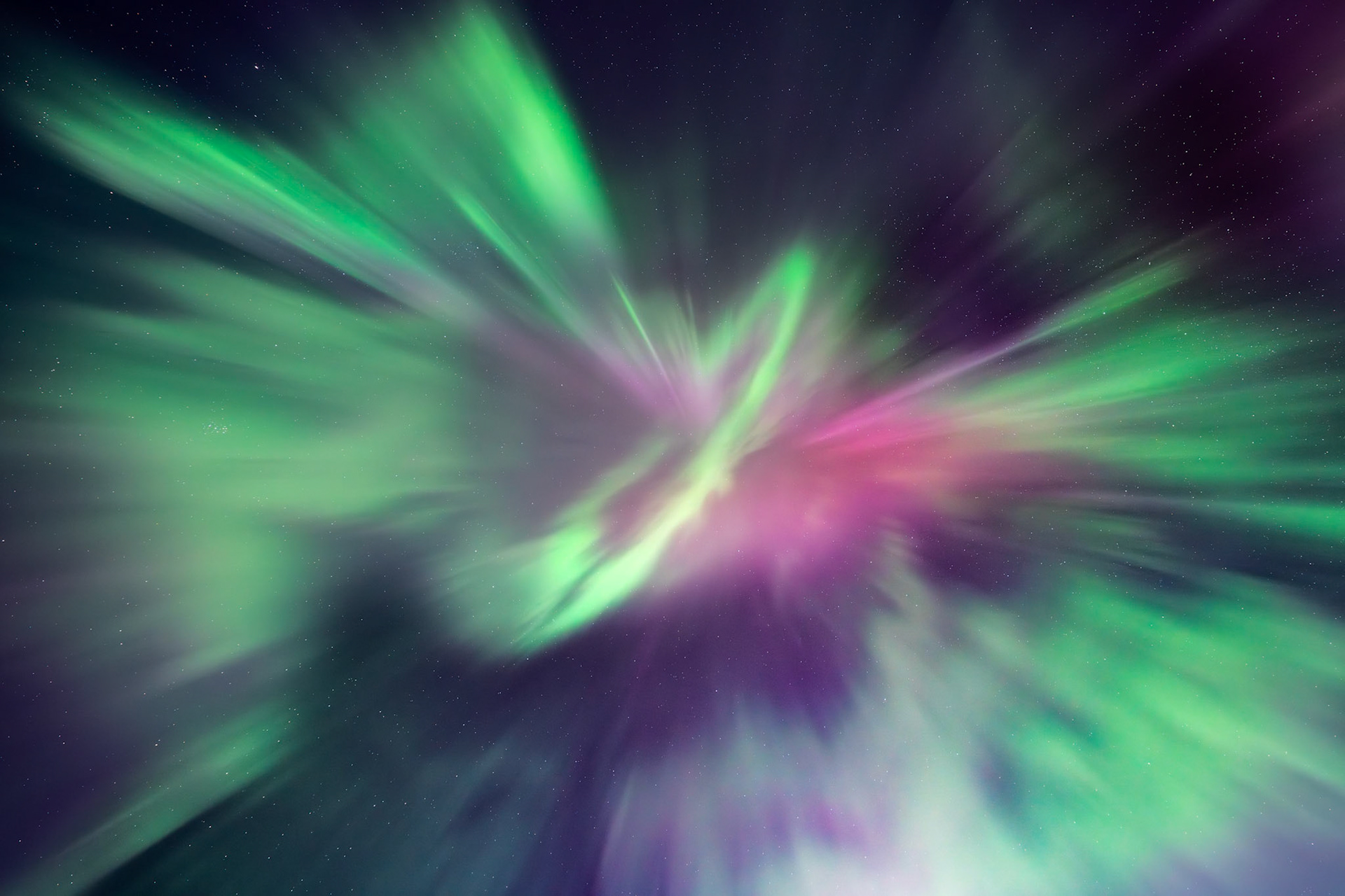 Coronal aurora explodes outward from a ring shape, mimicking a sonic boom.