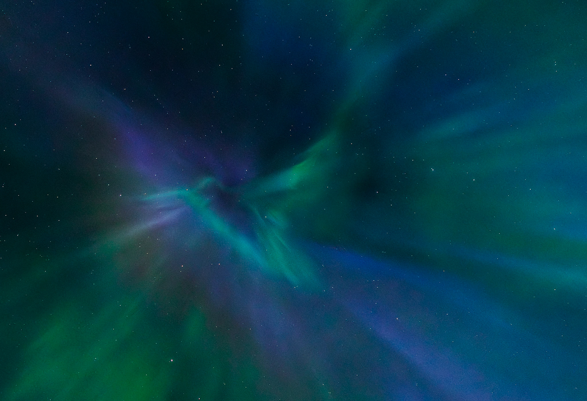 An ethereal hummingbird born of auroral light hovers in the night sky, present for but a fleeting moment and gone in the blink of an eye, much like its earthly counterpart.