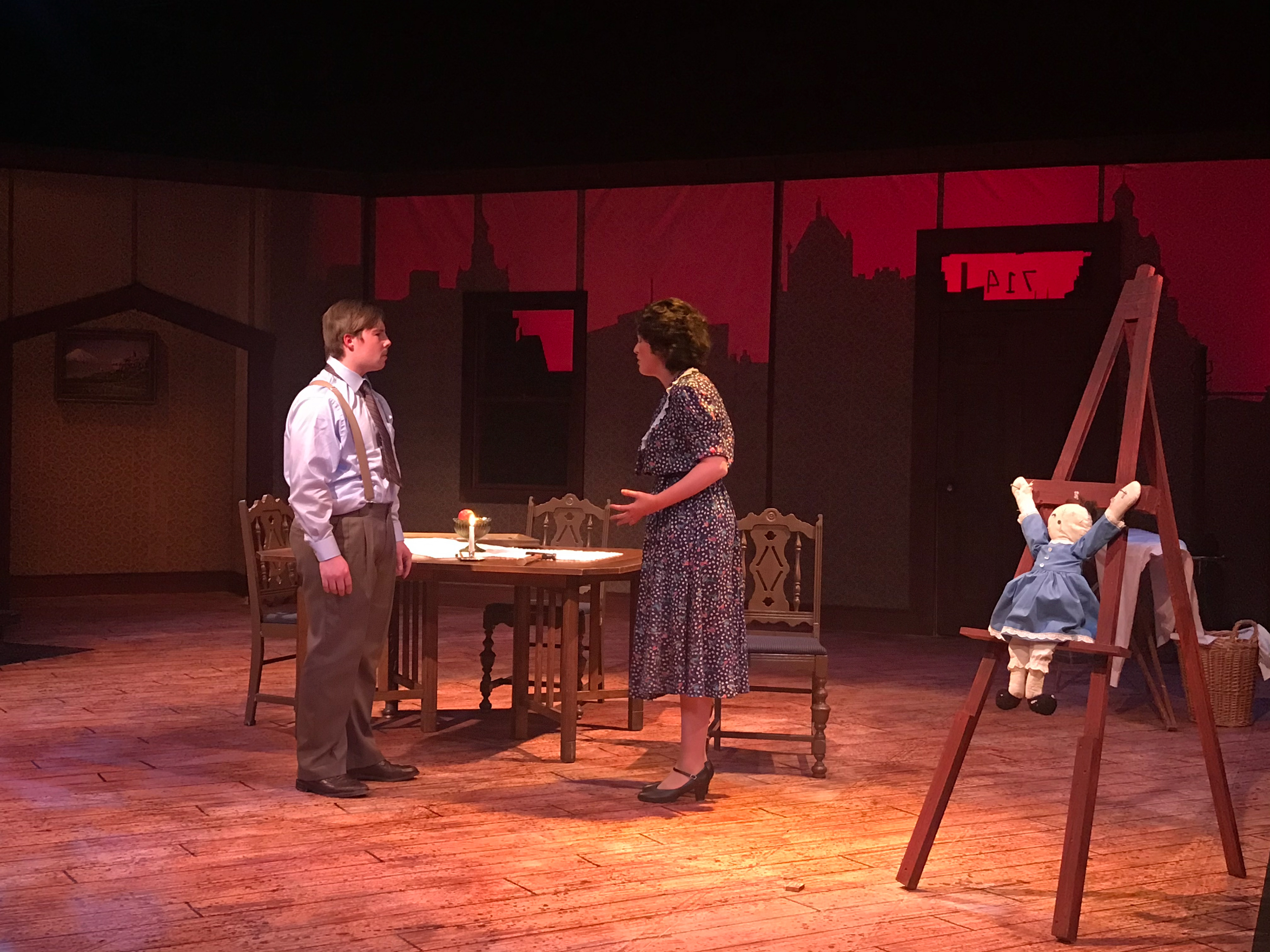 Crucified doll on photo frame.