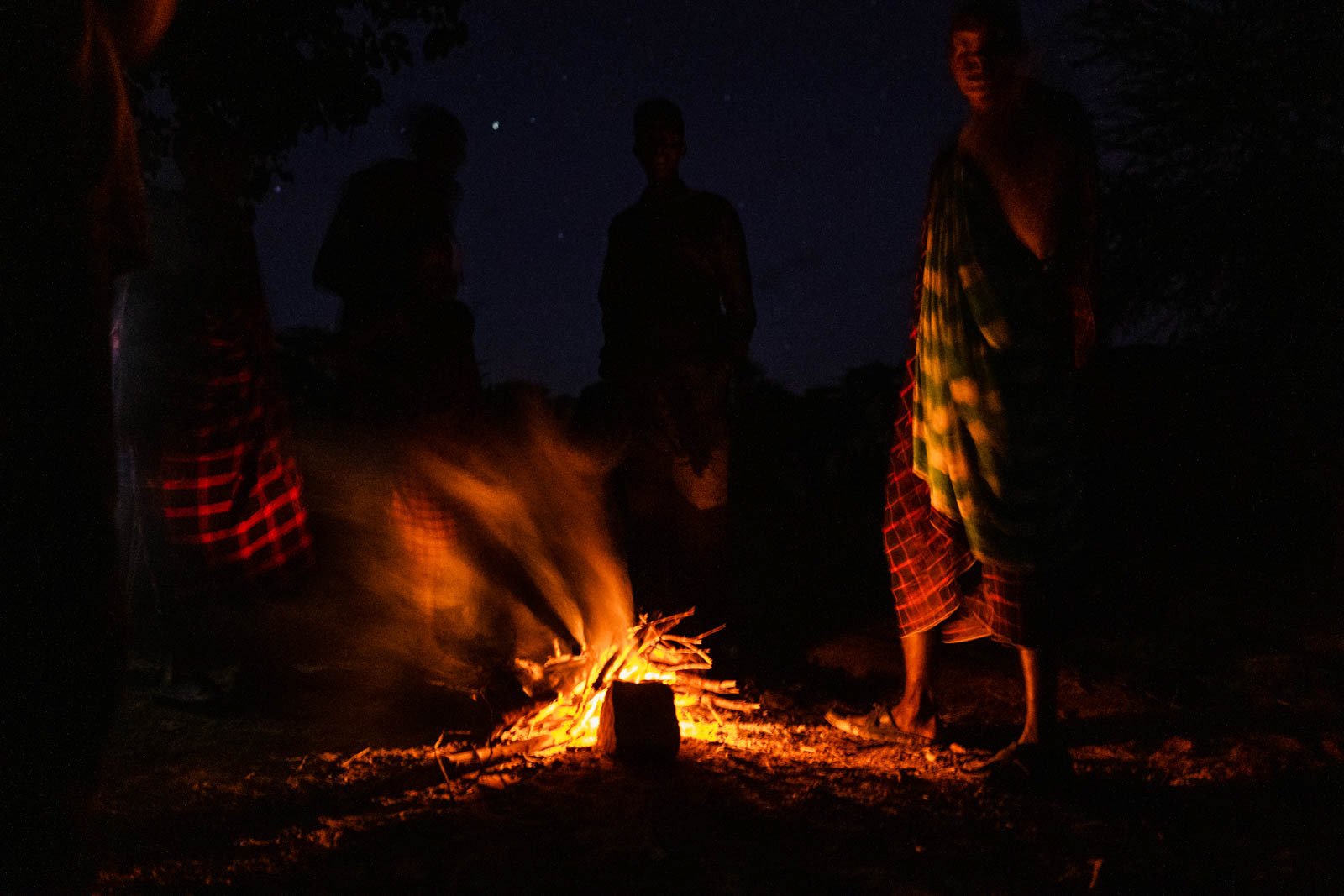 Maasai welcoming us at their fire pit