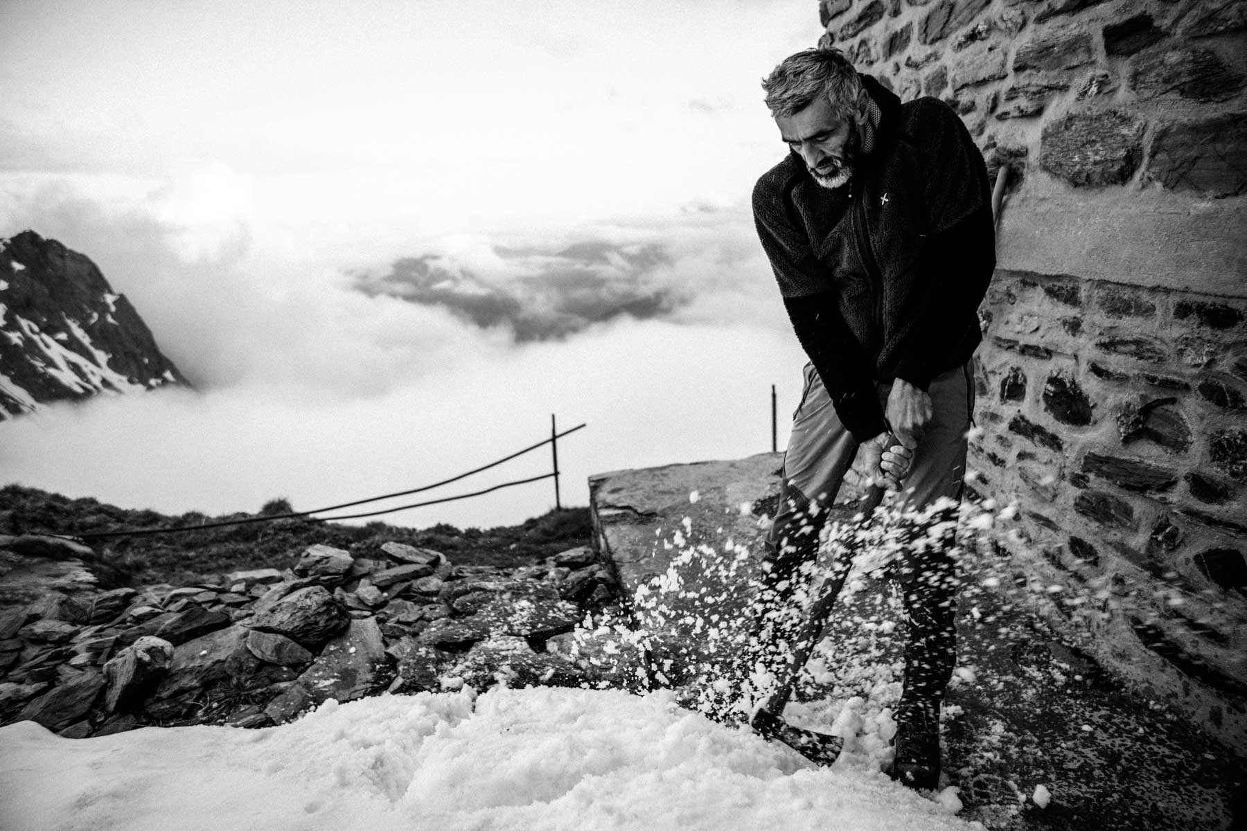 Chipping up the snow to clear a path