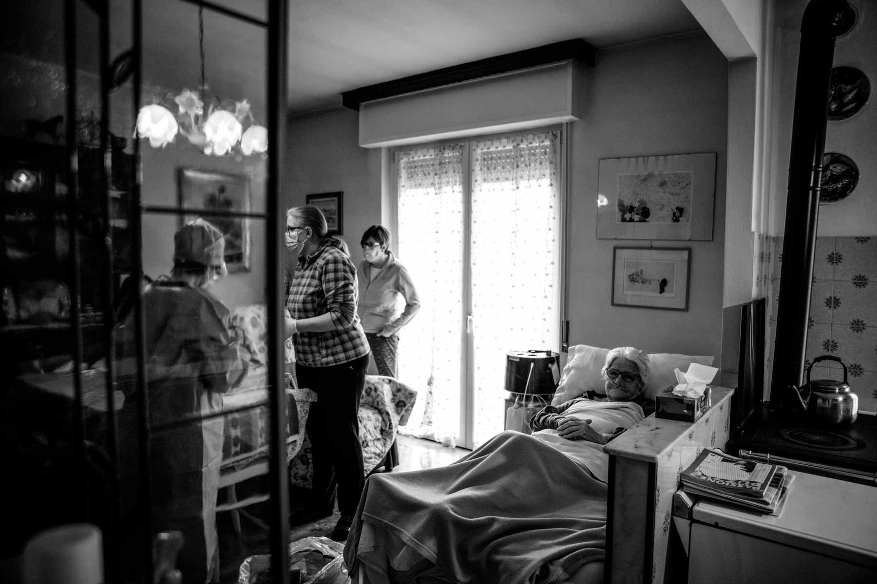 COVID Special Unit family doctor checking on a post hospitalized covid patient