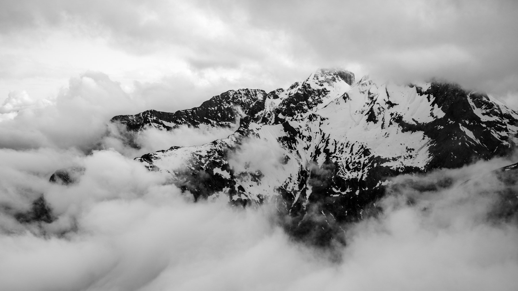 Clouds crushing over the peaks