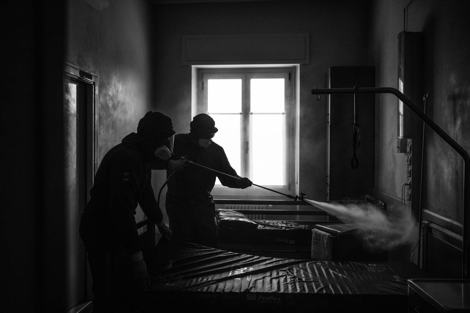 Russian soldier from a special unit sanitizing a House for the Elder