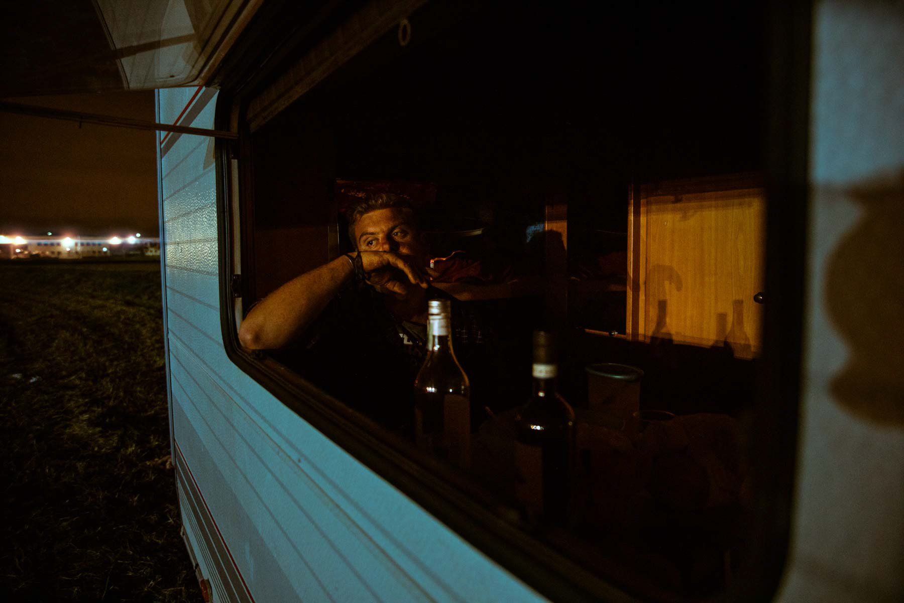 Eddy contemplate the distant lights while smoking the last cigarette