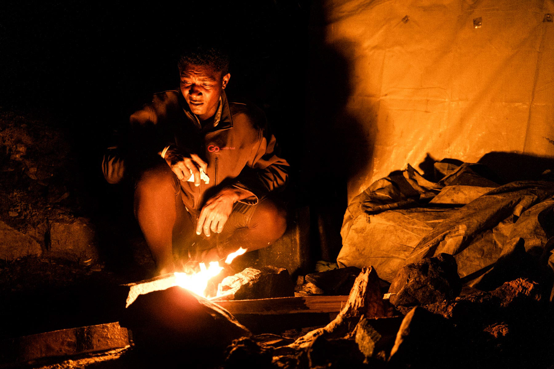 Preparing a small fire to cook