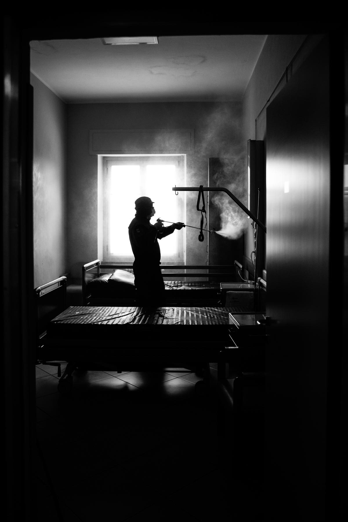Russian soldier from a special unit sanitizing a House for the Elder