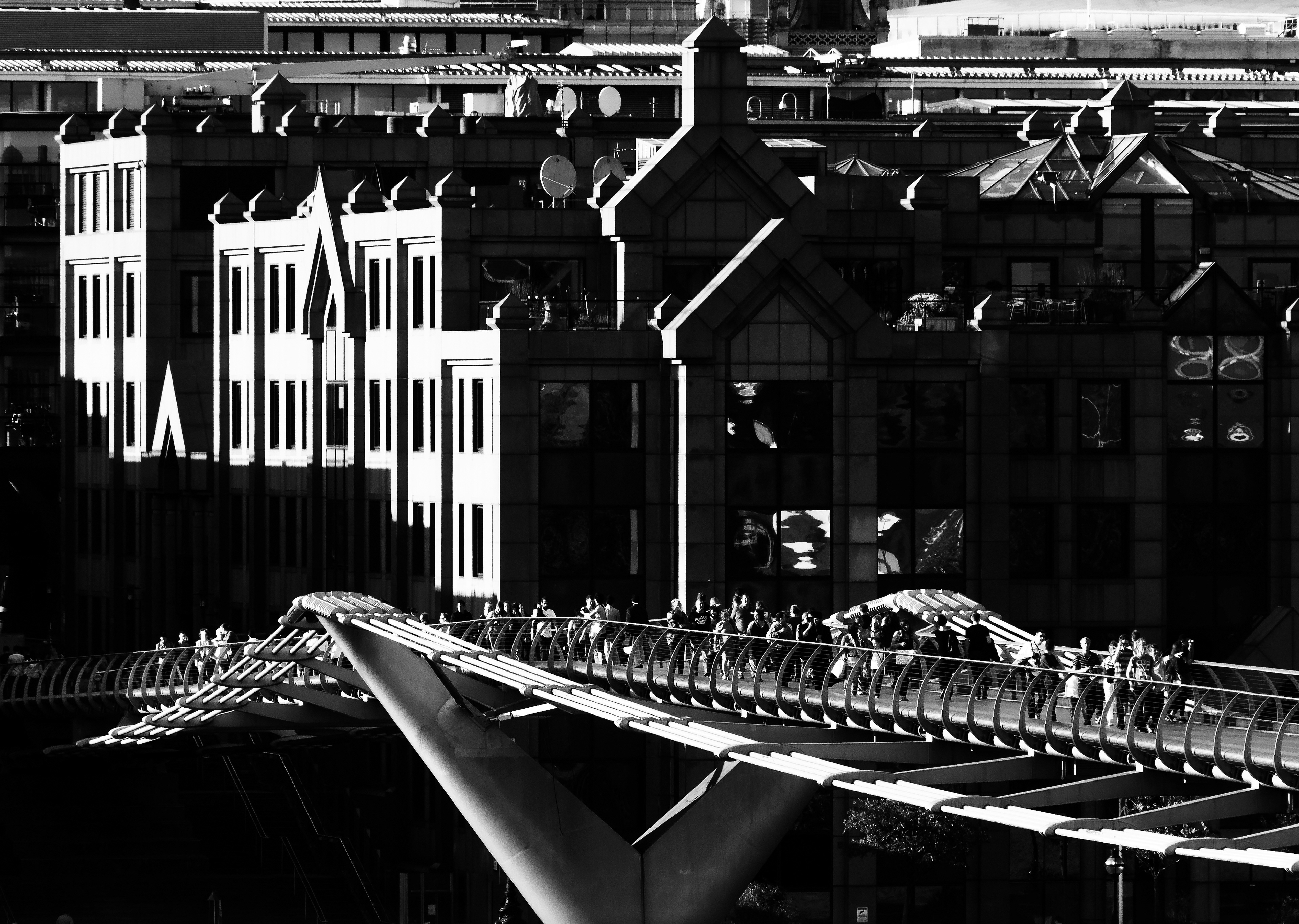 Black and white shot of the Millennium Bridge in London, UK