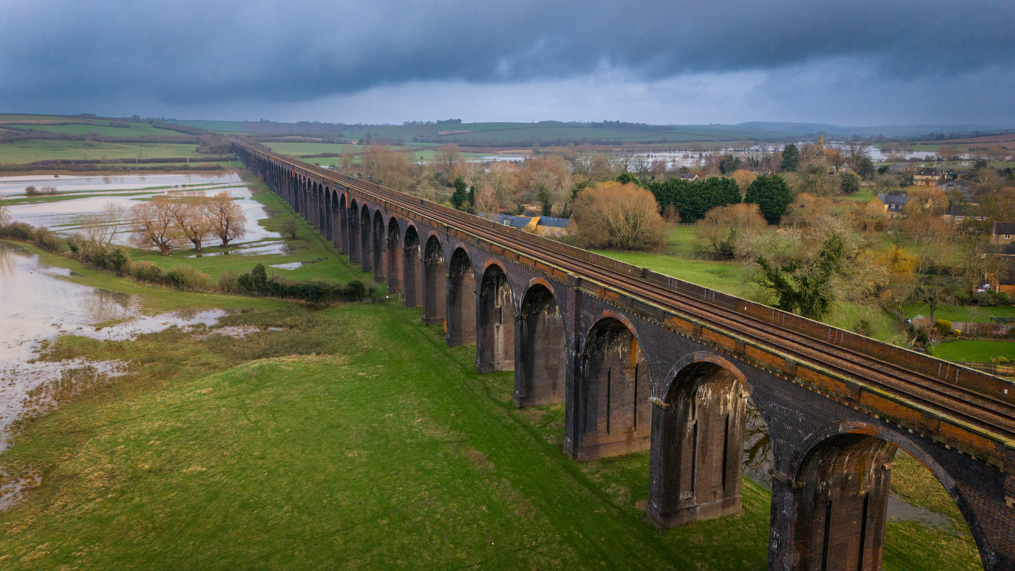 Welland Viaduct, The viaduct is 1,275 yards (1.1km) long and has 82 arches, each with a 40 feet (12 m) span. It is the longest masonry viaduct across a valley in the United Kingdom. Built by the contractor Lucas and Aird, a total of 30 million bricks were used in the viaduct's construction. Completed during 1878, it has since become a Grade II listed building.