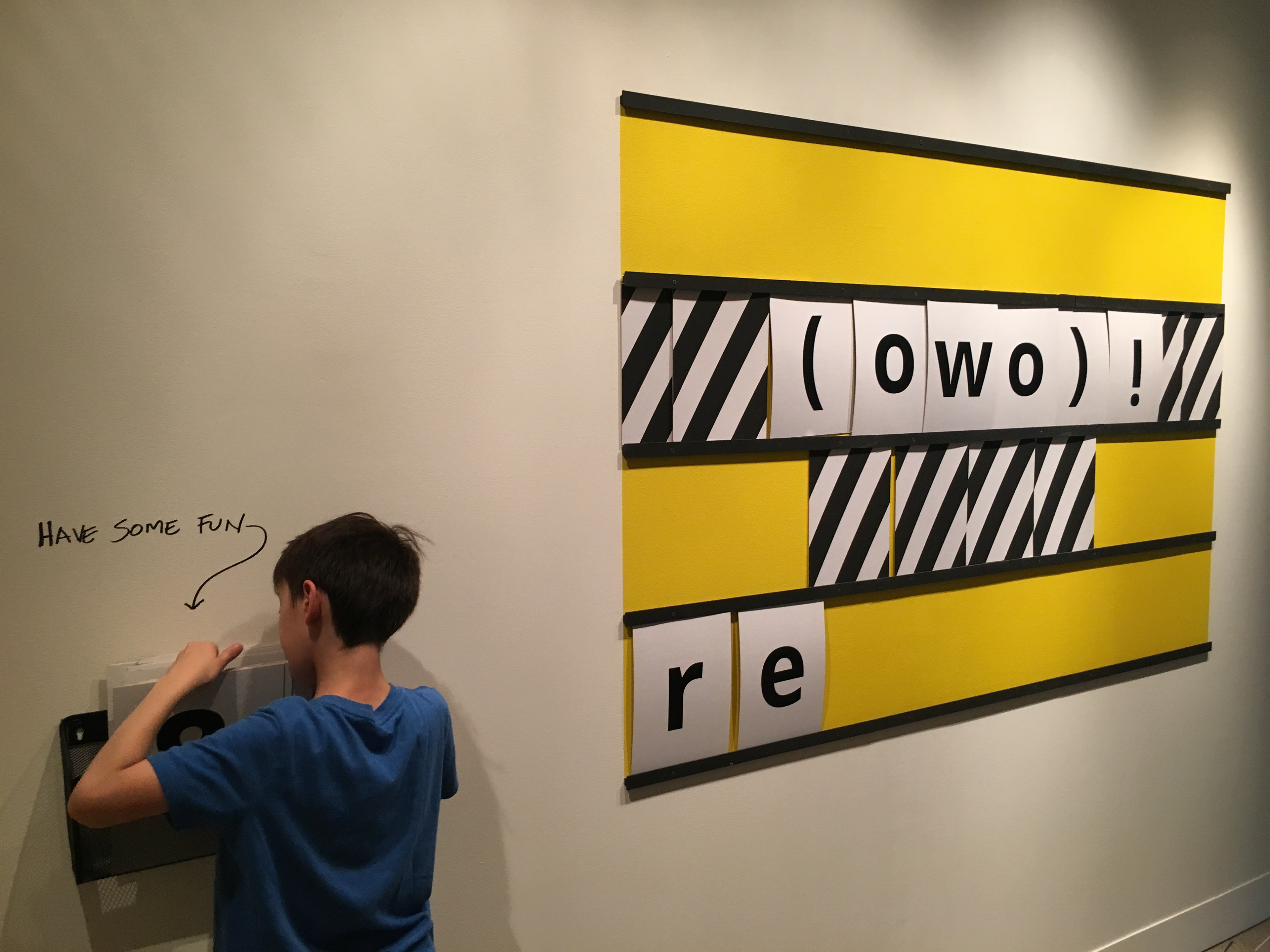 A visitor playing with the sign.