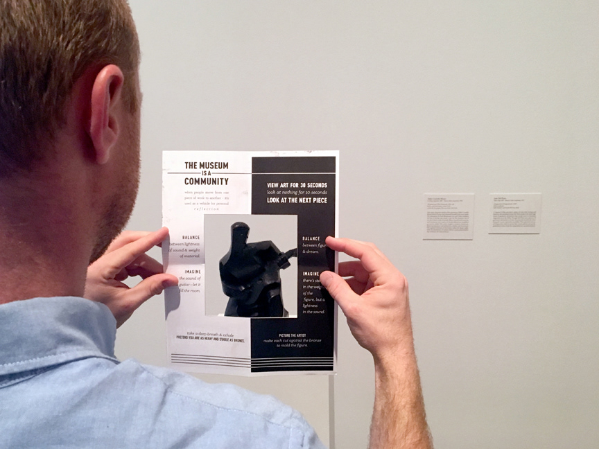 Image of someone looking at a piece of art through the viewfinder