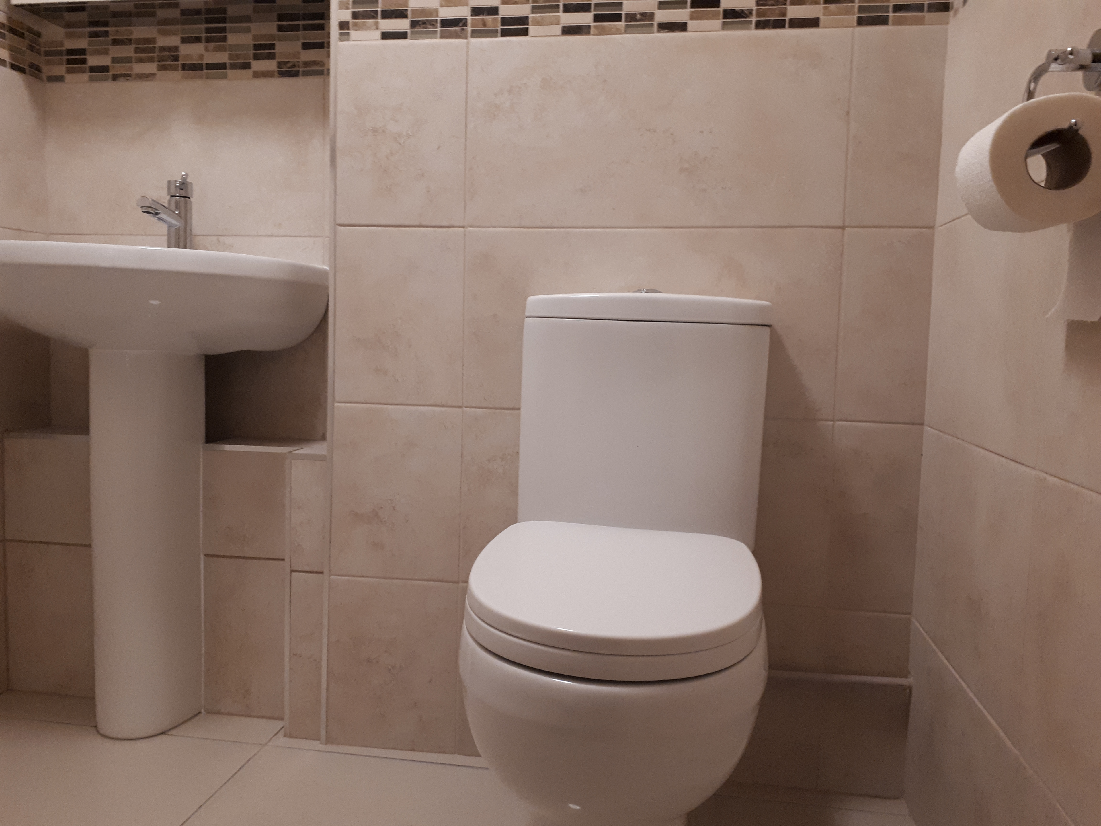 A washroom that I tiled floor to ceiling.