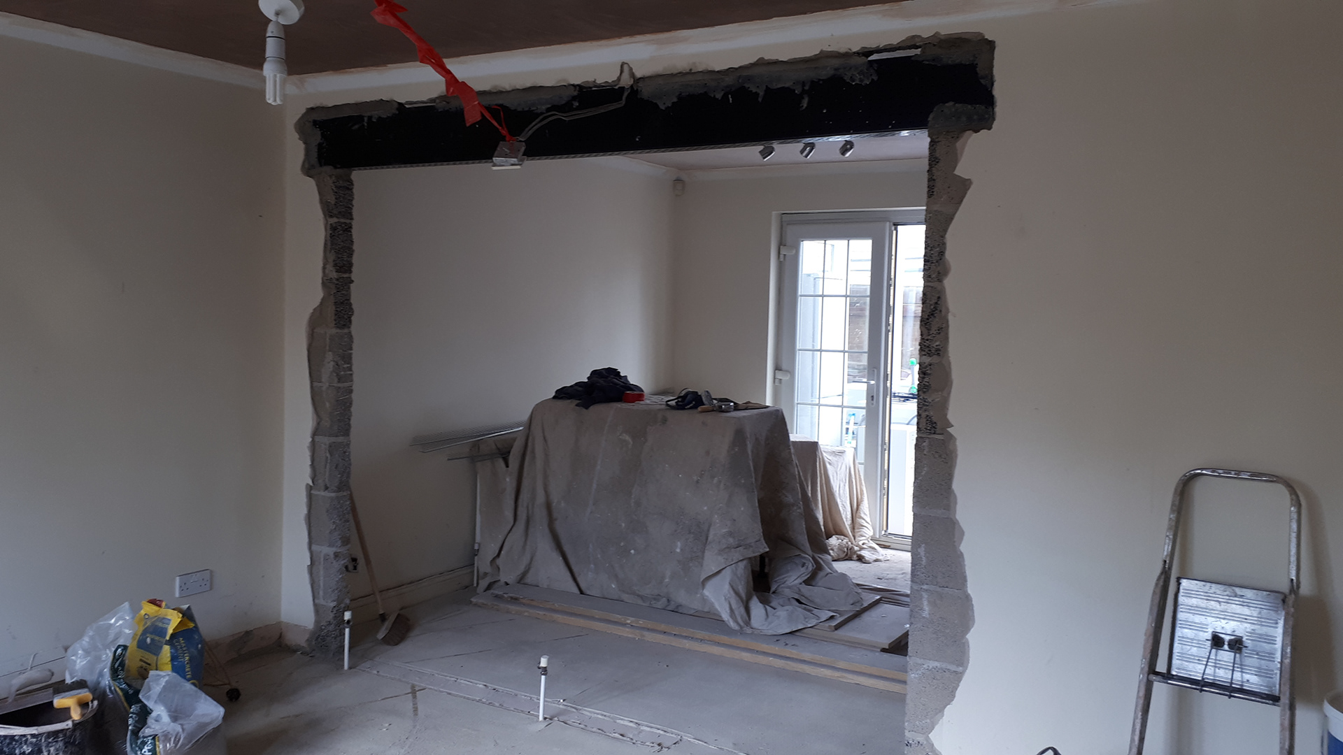 Here we removed a wall and supported the opening with a RSJ (Rolled Steel Joist)