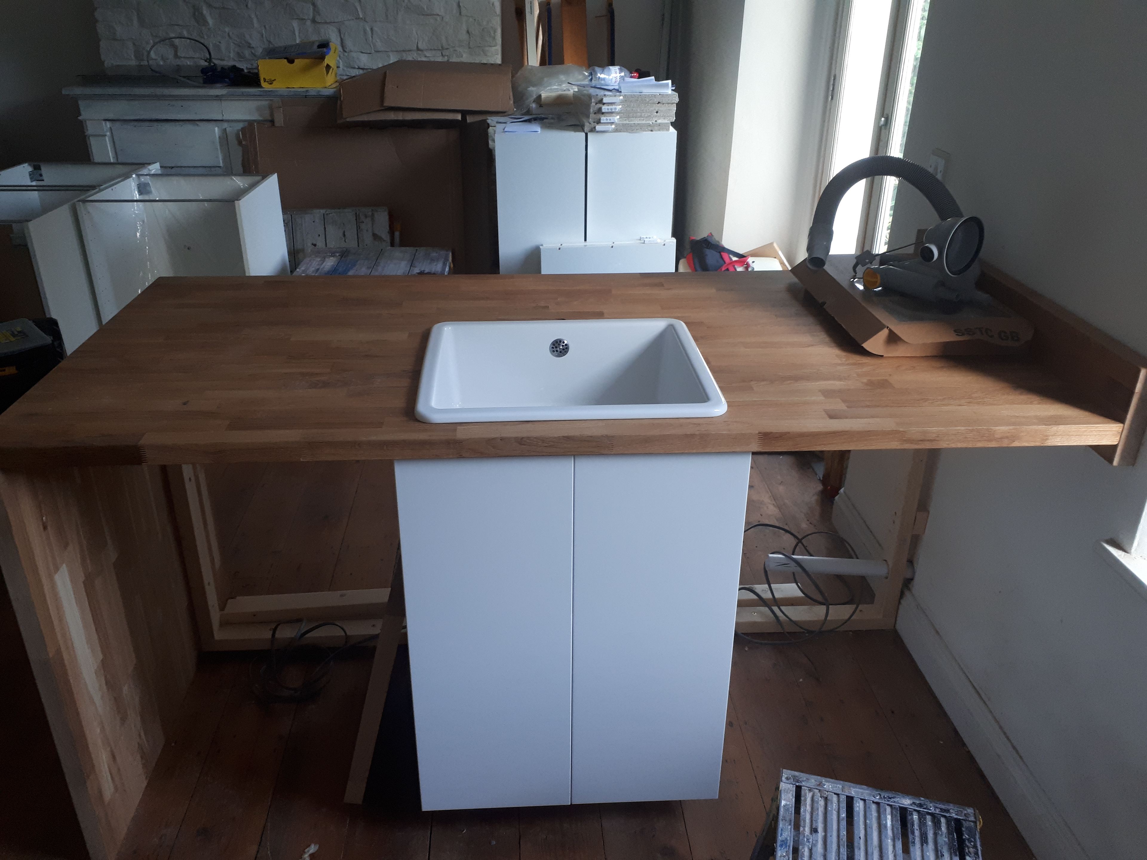 Solid Wood Kitchen Peninsula being Fitted