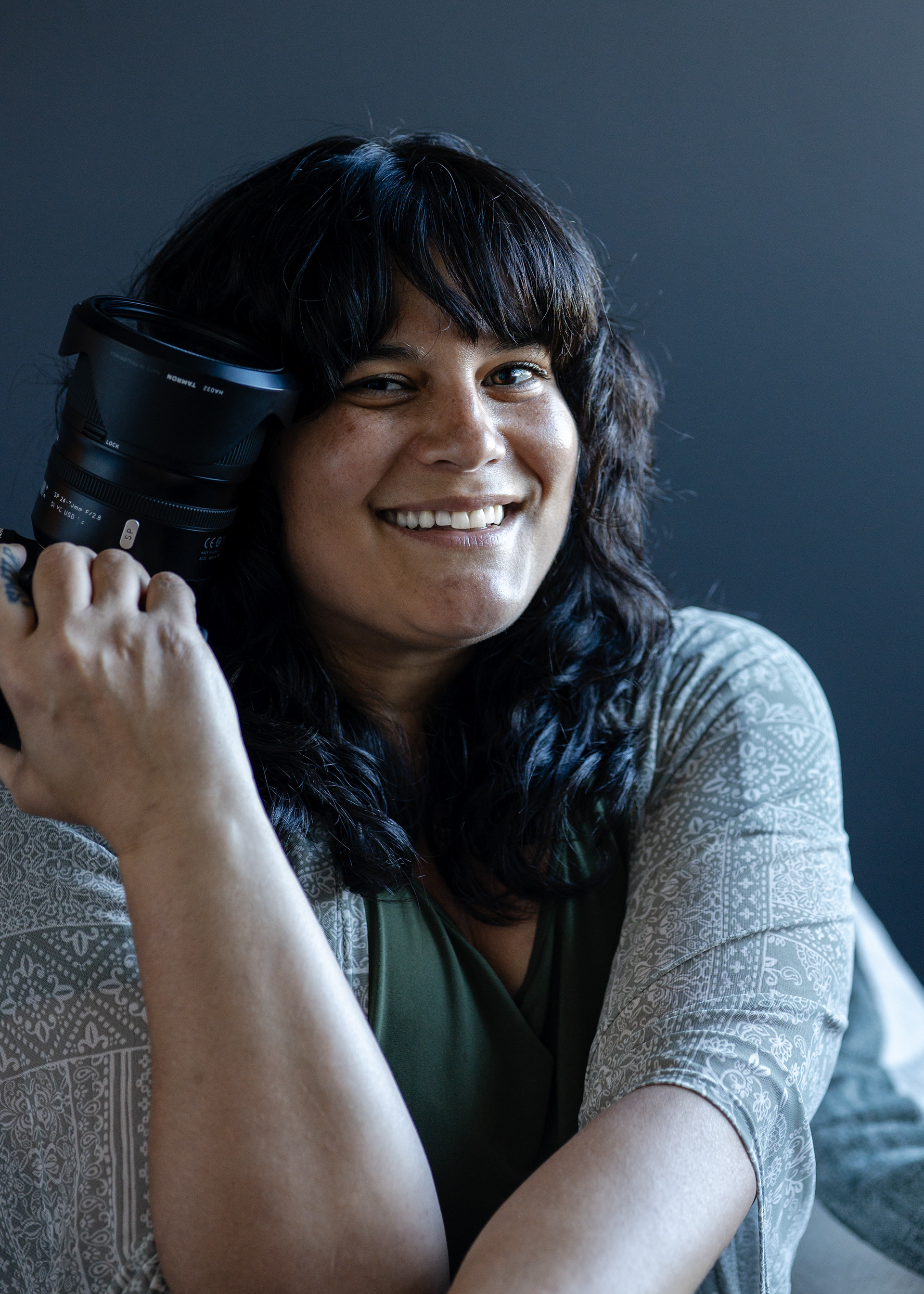 woman smiling with her camera