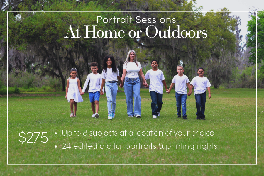 Grandma walks in the middle of a line with her grandkids. They all hold hands and smile.