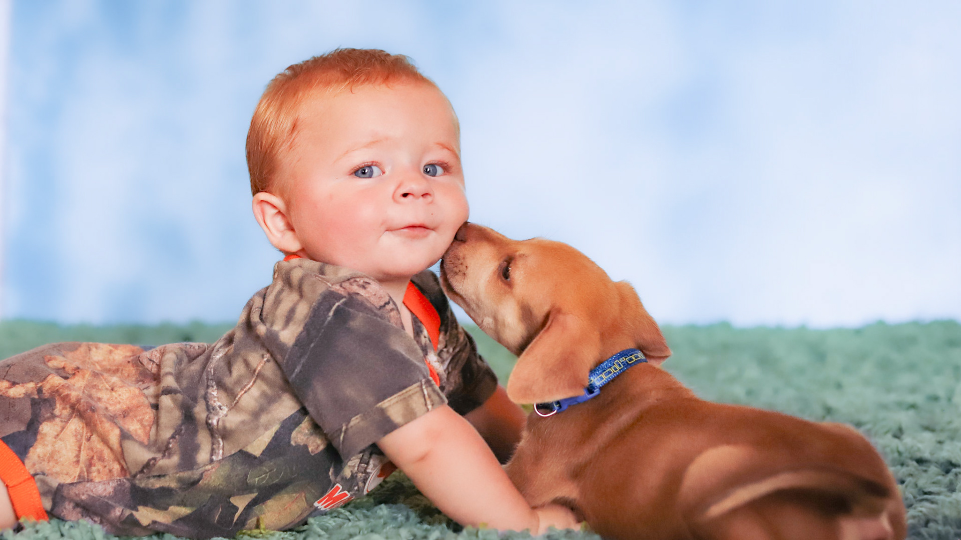 Baby and puppy portrait