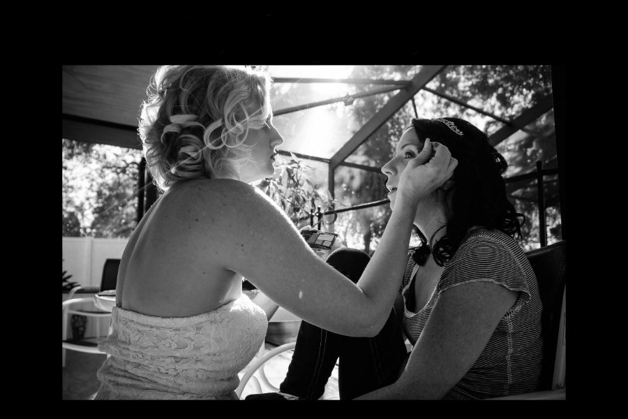 Candid portraits capture special moments of excitment and anticipation while the couple get dressed and ready for their wedding.