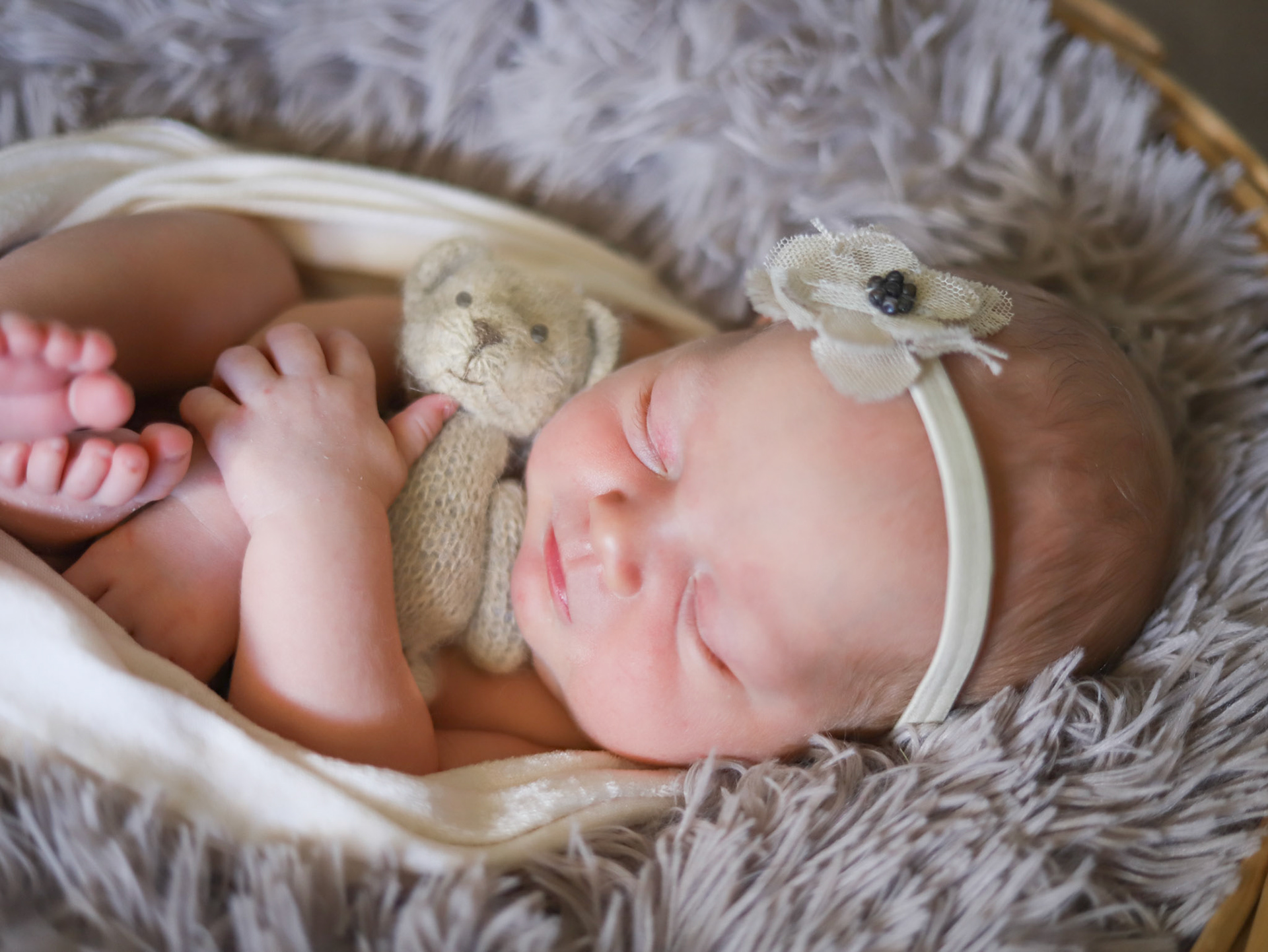 Newborn girl hugs, Teddy bear