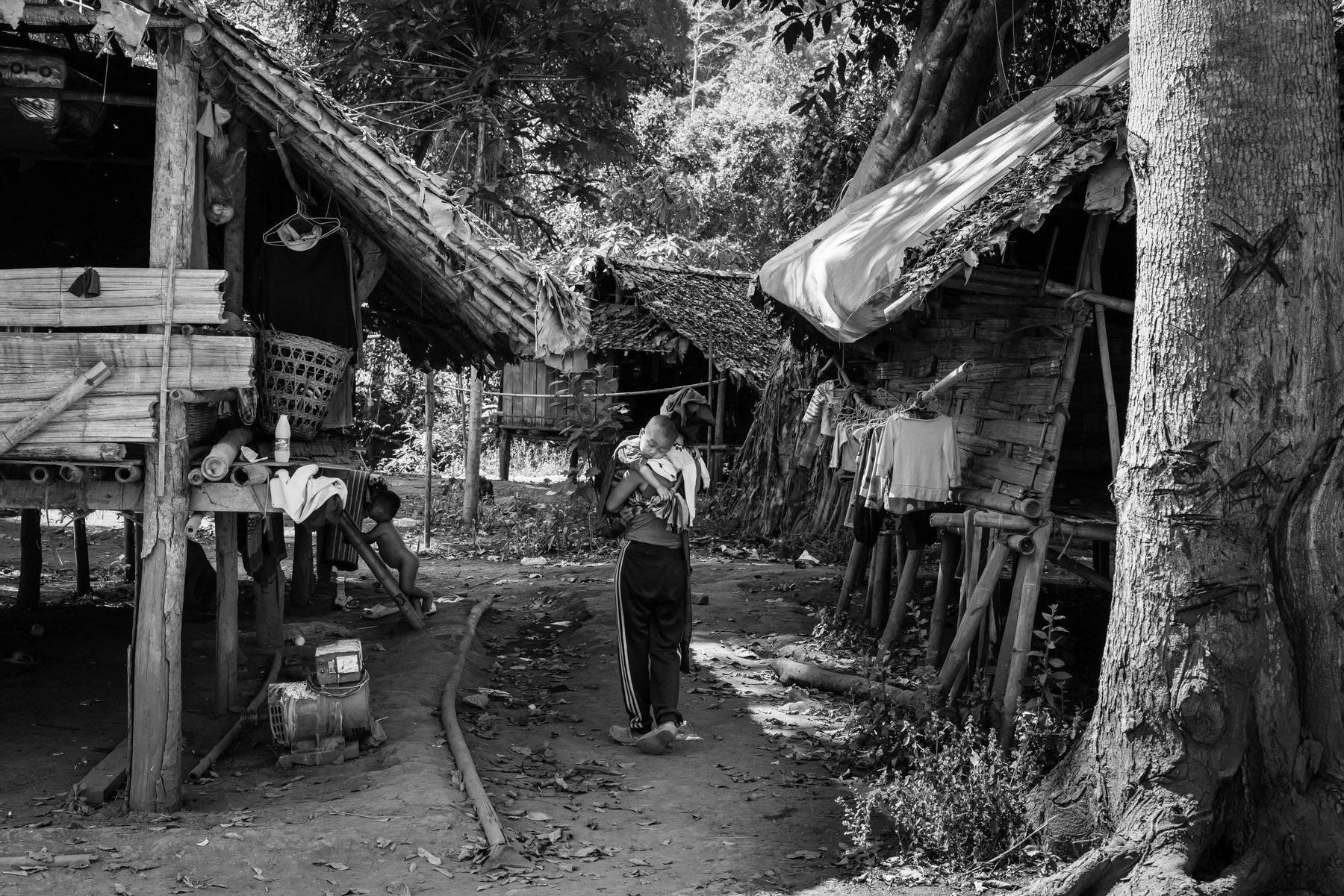 A Karen woman and her child in a camp for internal displaced persons. More than 3 million people have been displaced by the conflict in Myanmar. Htaw IDP camp in Kanele in Karen State, Burma, January 2024