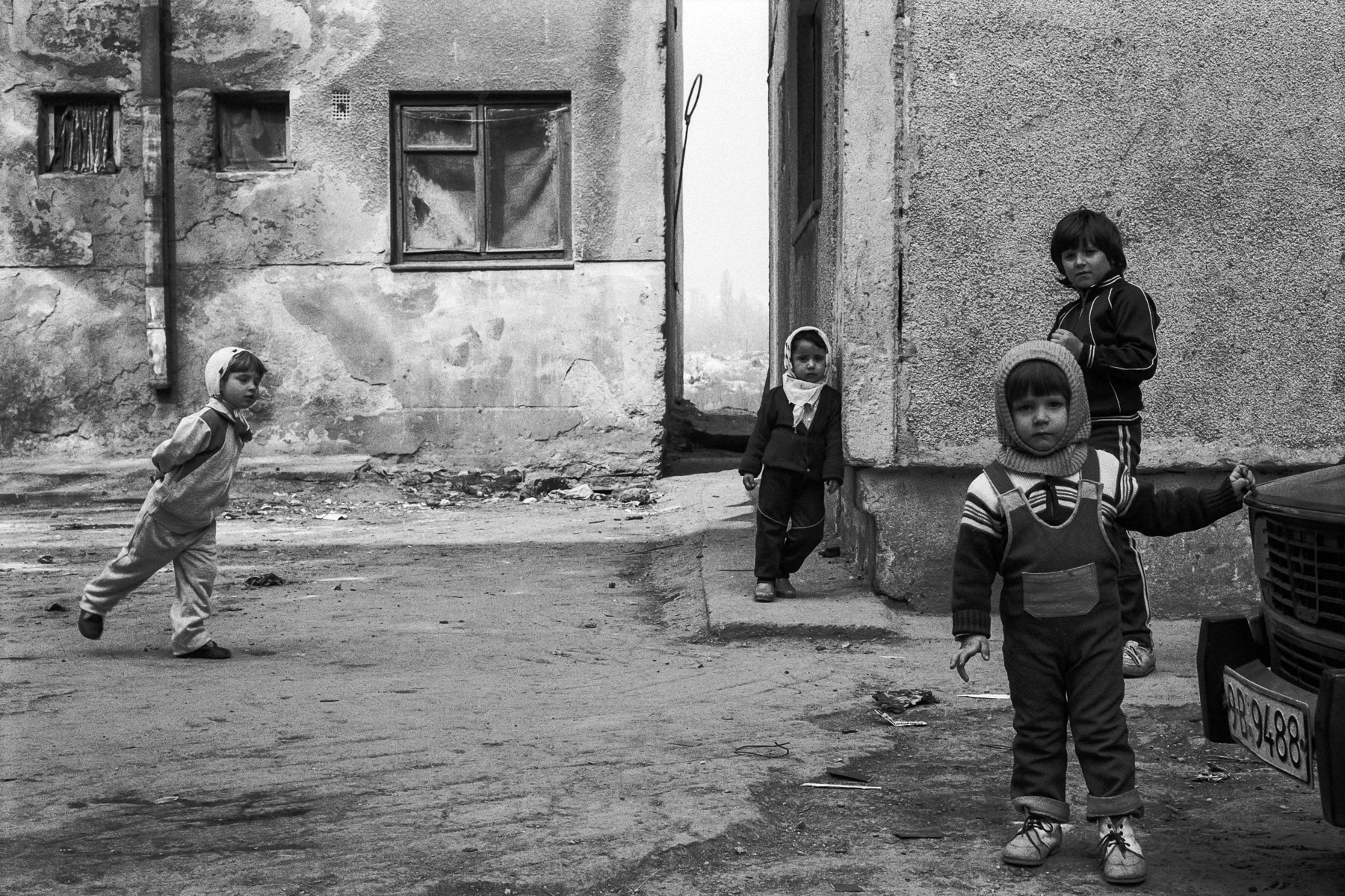Romania in the immediate aftermath of the December 1989 revolution that culminated in an expeditive trial of the Ceausescu couple and their execution. The photographs were taken during several visits between 1990 and 1991 and are one of my first reportages in a politically and socially affected country. Playing in between apartment blocks, Bucharest, Romania, April 1991