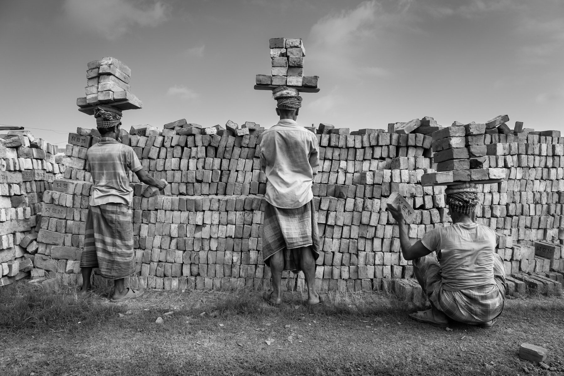 All brick transfer from fields to kilns and ultimately the storage places are done manually. Amin Bazar brick fields near Dhaka, May 2015