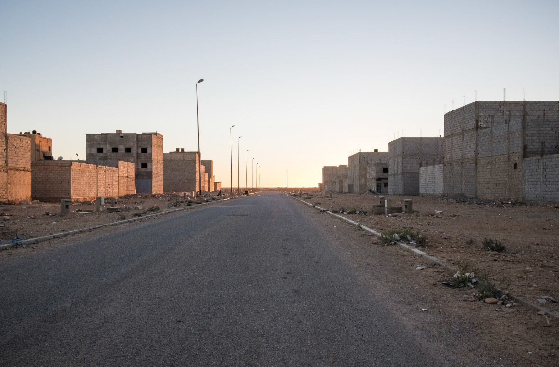 Rudimentary accomodation blocks built by the Moroccan authorities. The authorities try very hard to attrack Morrocans to settle in the disputed territory of the Western Sahara by building infrastructure and new neighbourhoods on the edge of the capital. Laayoune, Western Sahara, December 2018