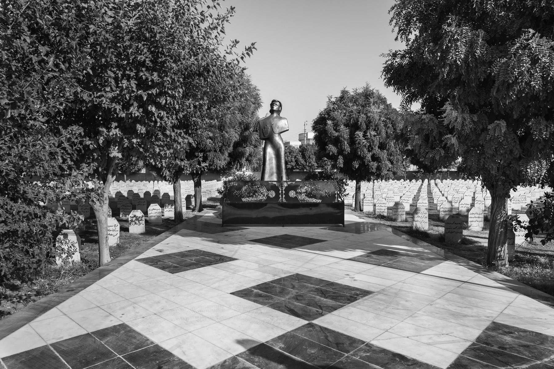 16 March 1988, more than 450 chemical shells were dropped by Saddam Hussein over Halabja in Iraqi Kurdistan killing 5,000 Kurdish civilians and injuring another 10,000 most of which would die in the years to follow. The survivors were evacuated to Iran in the aftermath and returned to northern Iraq after the first Gulf War in 1991. Today, 475 victims still live in the city of Halabja in the autonomious Region of Iraqi Kurdistan. They face severe health and psychological problems since the attack, such as severe repiratory problems requiring oxygen breathers, systematic eye and sight problems, fertility issues for those affected as children, high rates of miscarriage and serious mental health issues. With inadequate health services available, most patients can only hope to be sponsered and be sent to Iran for specialized treatment. Main graveyard and mass graves for the victims of the Halabja chemical weapons attack, Iraqi Kurdistan, Iraq, August 2018