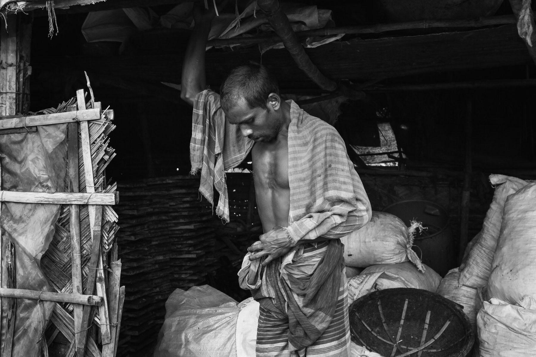 Worker at an informal scrap leather recycle point, Hazaribagh, Dhaka, Bangladesh, October 2014