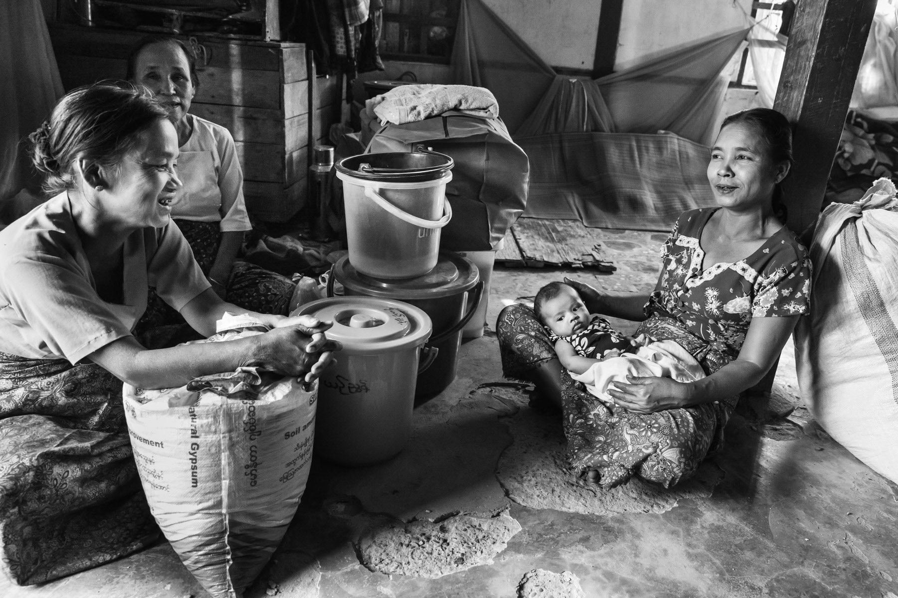 Arkanese IDPs in an overcrowded shelter housing 350 displaced persons with insufficient space and sanitary facilities. Conflict escalation between the military and the Arakan Army rebel group has uprooted more than 100,000 civilians since begining 2019. Kyakrit Khee Saw Monastery IDP Camp, Mrauk-Oo, Rakhine, Myanmar, February 2020