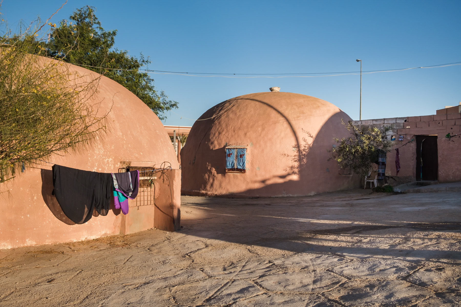 Houses built by the authorities looking like a nomad's tent. The Moroccan authorities try very hard to attrack Morrocans to settle in the disputed territory of the Western Sahara by building infrastructure and vast accomodation blocks in the capital. Laayoune, Western Sahara, December 2018