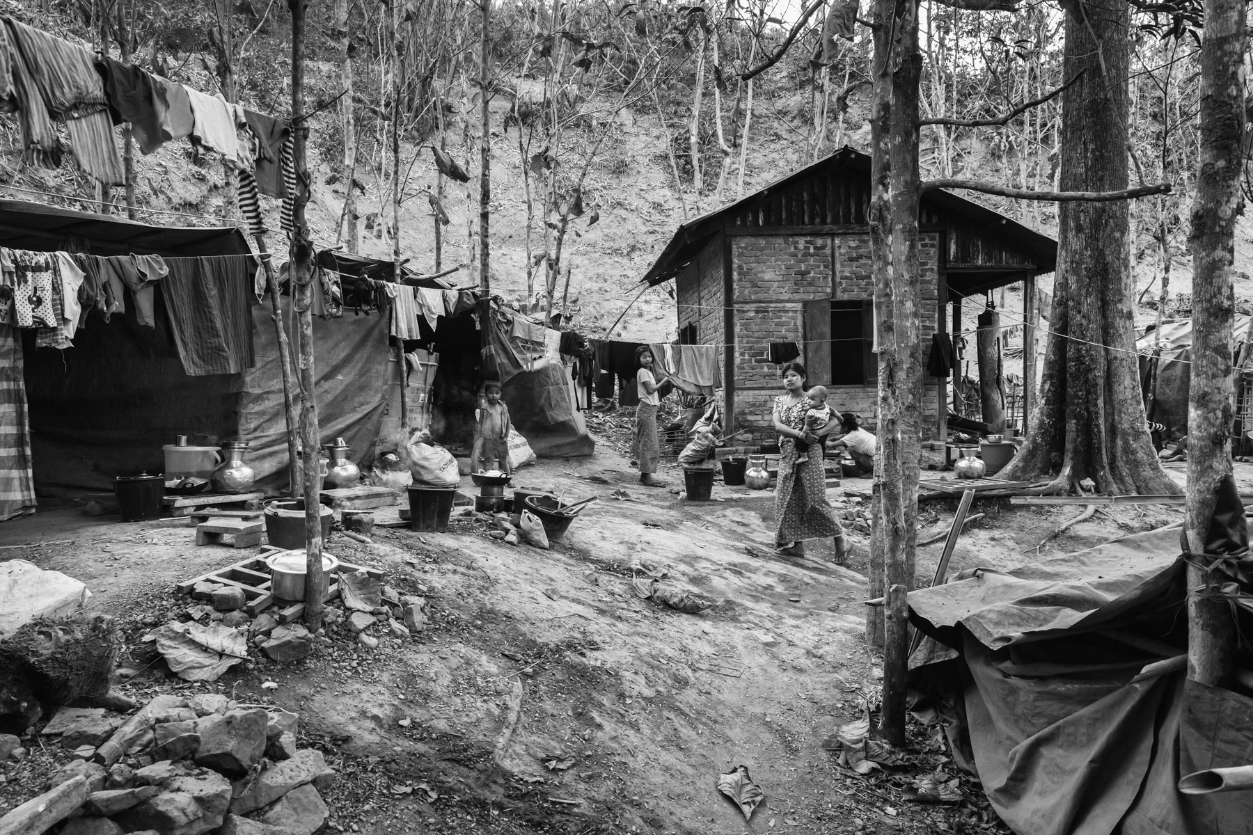 Precarious shelters set up on monastery owned land. With increased fighting between the military and the Arakan Army rebel group more than 100,000 persons have been displaced, Collective centres in monasteries are overcrowded forcing people out in rudimentary shelters with no facilities. Lahakaiza Monastery IDP camp, where more than 500 people found refuge. Mrauk-Oo in Rakhine State, Myanmar, February 2020