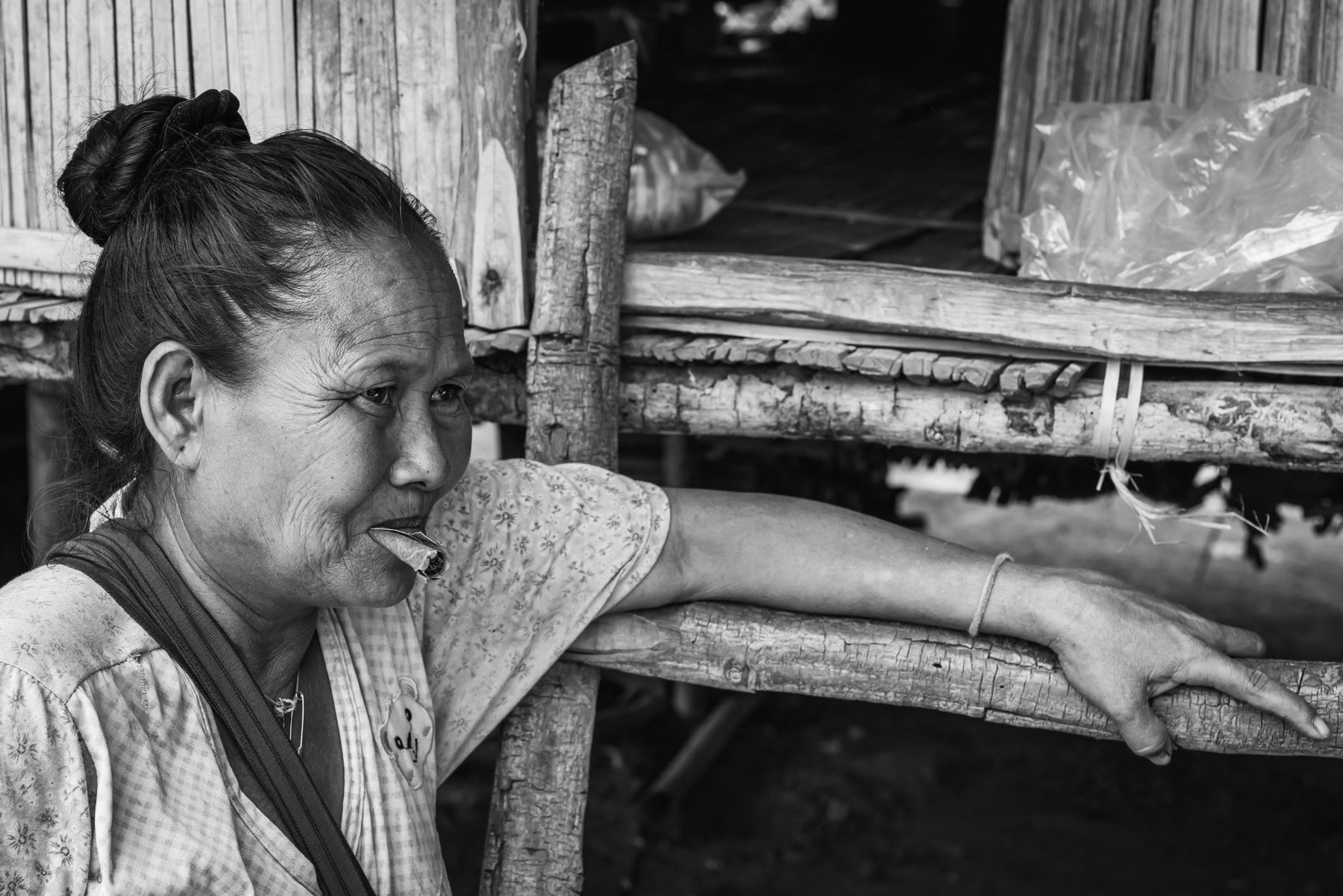 Karen woman internally displaced due to the conflict and risk of villages being hit by air strikes. Htaw IDP camp near Kanele in KNLA controlled territory. Kayin State, Myanmar, May 2024
