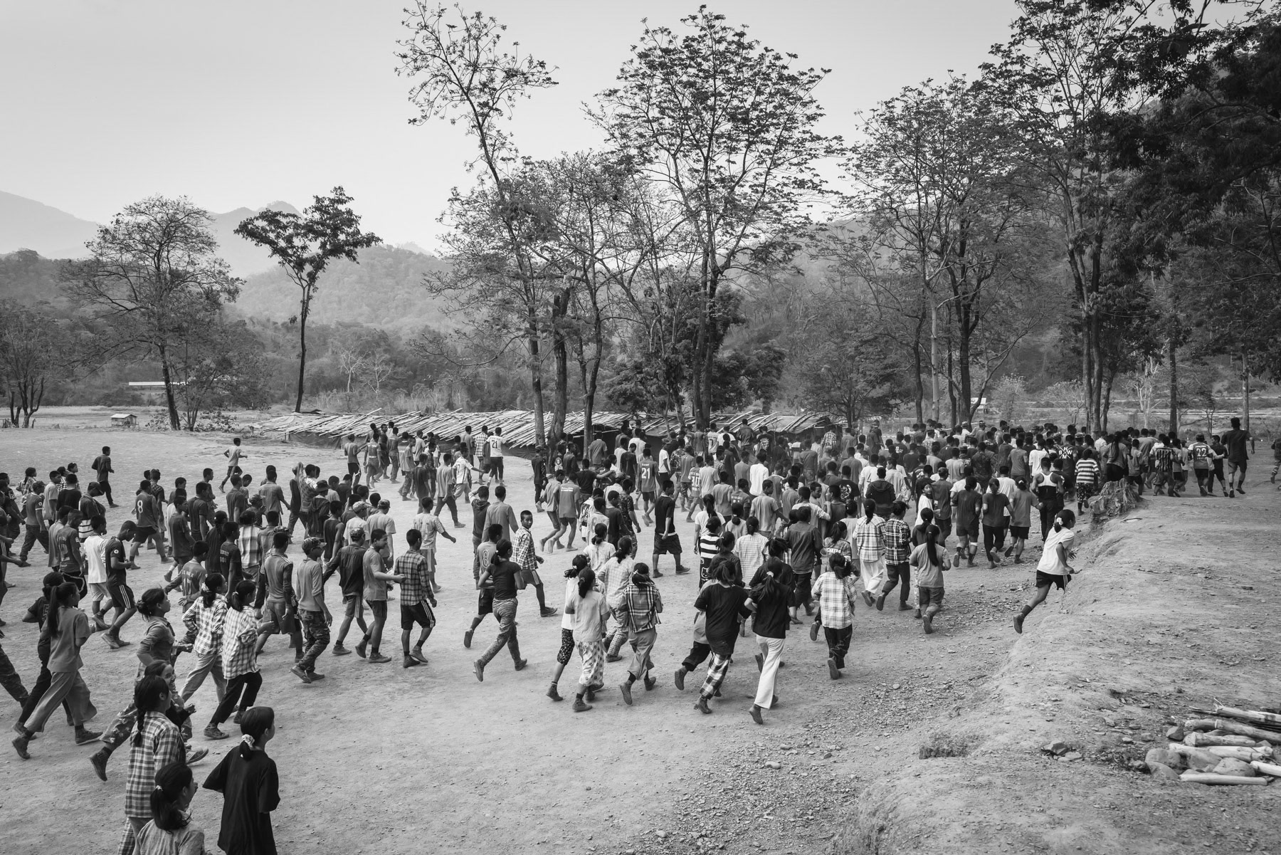 New recruits for the Chin National Army (CNA) doing physical exercises during their lenghty training before integrating the CNA. The ever increasing air strikes and forced military service enacted by the military dictatorship, has substantially increased the number of people that engage and seek refuge with the ethnic armed groups opposing the military coup leaders. CNA HQ, Camp Victoria in Chin State, Myanmar, April 2024