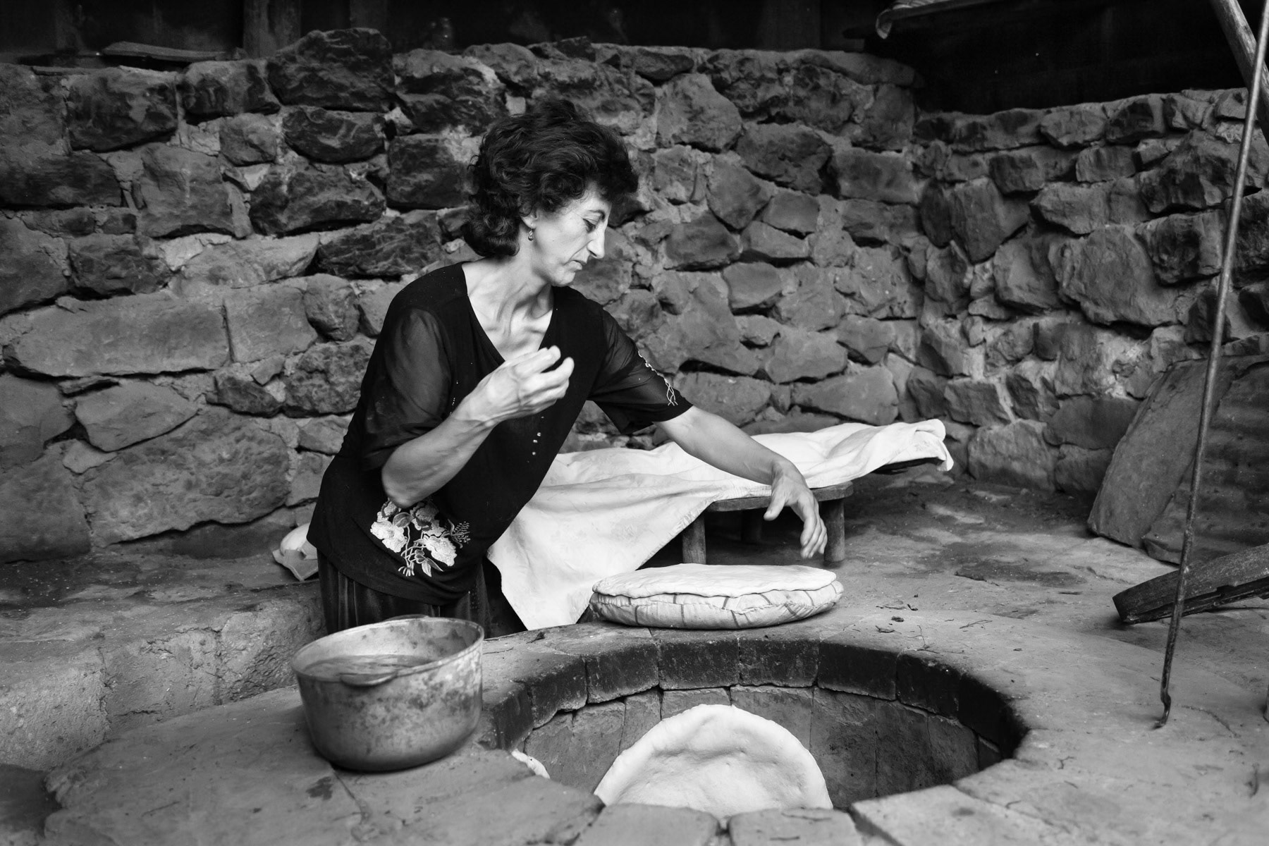 Bread baking in traditional public ovens in Taghlar, Nagorno-Karabakh, July 2014