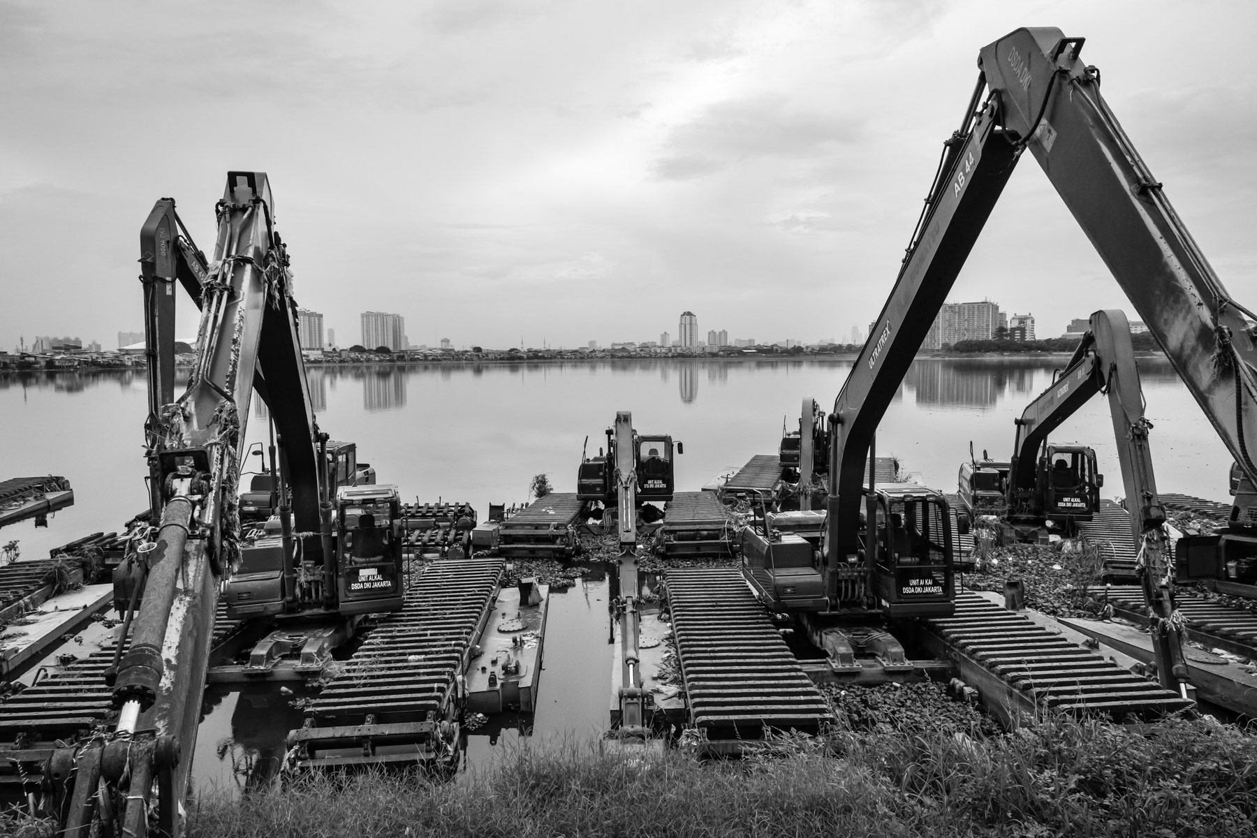 Heavy machinery used to keep the outflow of the artificial lake clean. Muara Baru, North Jakarta, Indonesia, March 2020