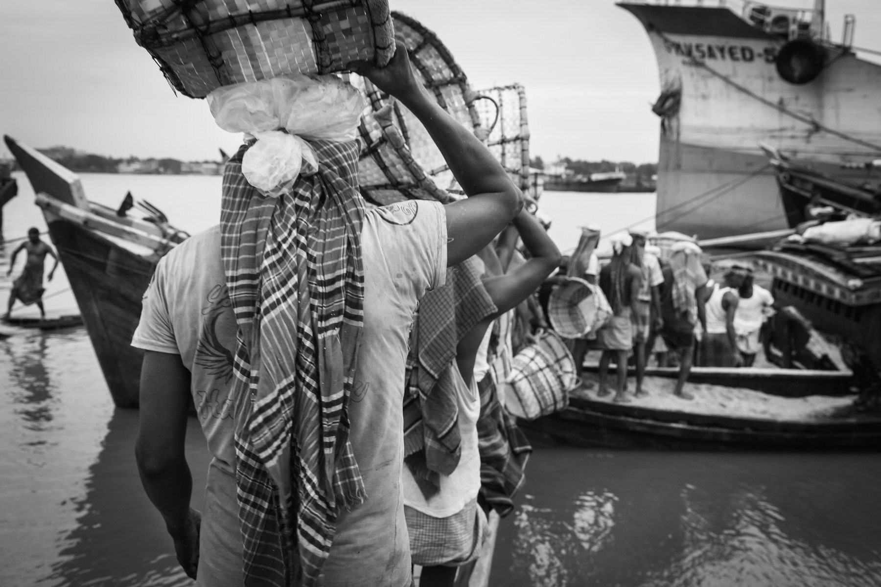 Dockyard workers unloading a salt shipment, Chittagong, Bangladesh, October 2014
