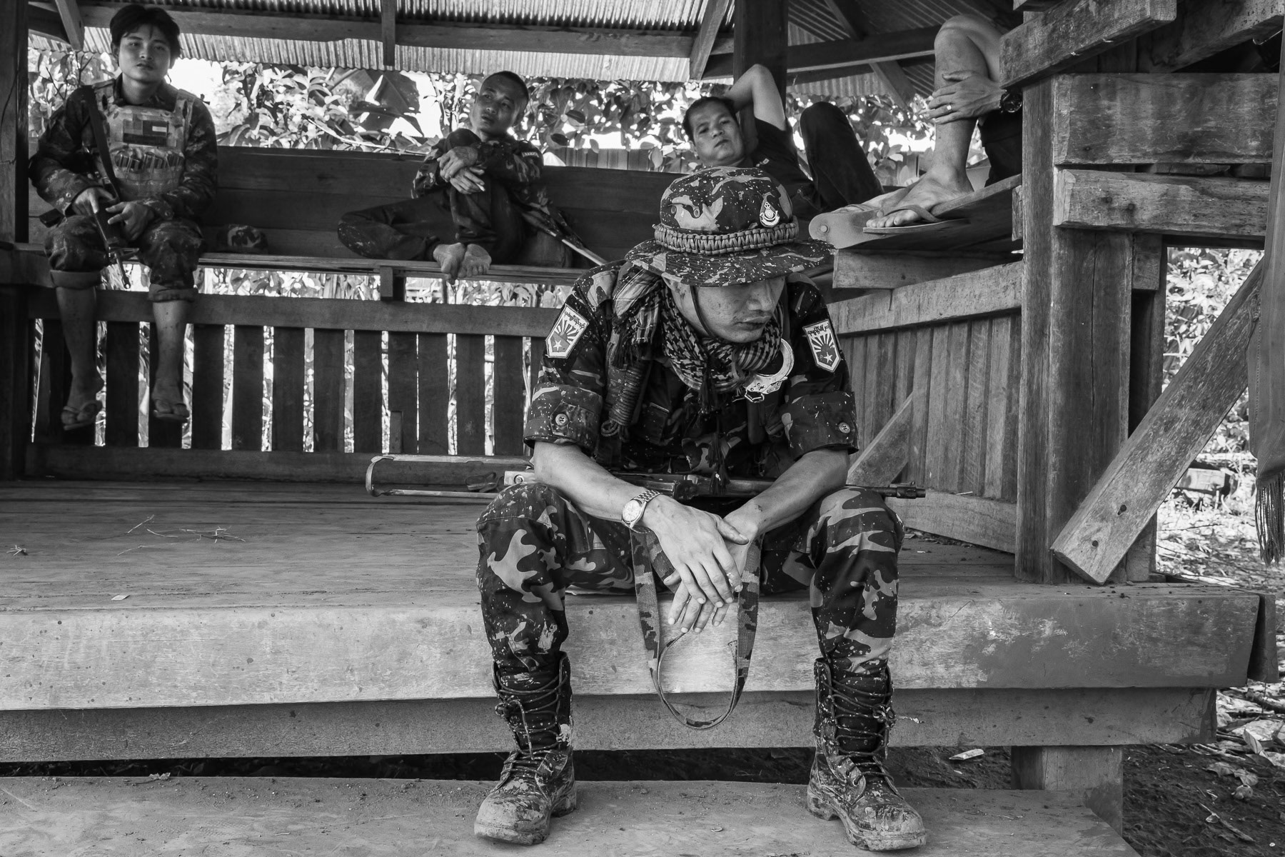 Karen National LIberation Army (KNLA) soldiers resting after returning from the frontline. Karen State, Myanmar, September 2024