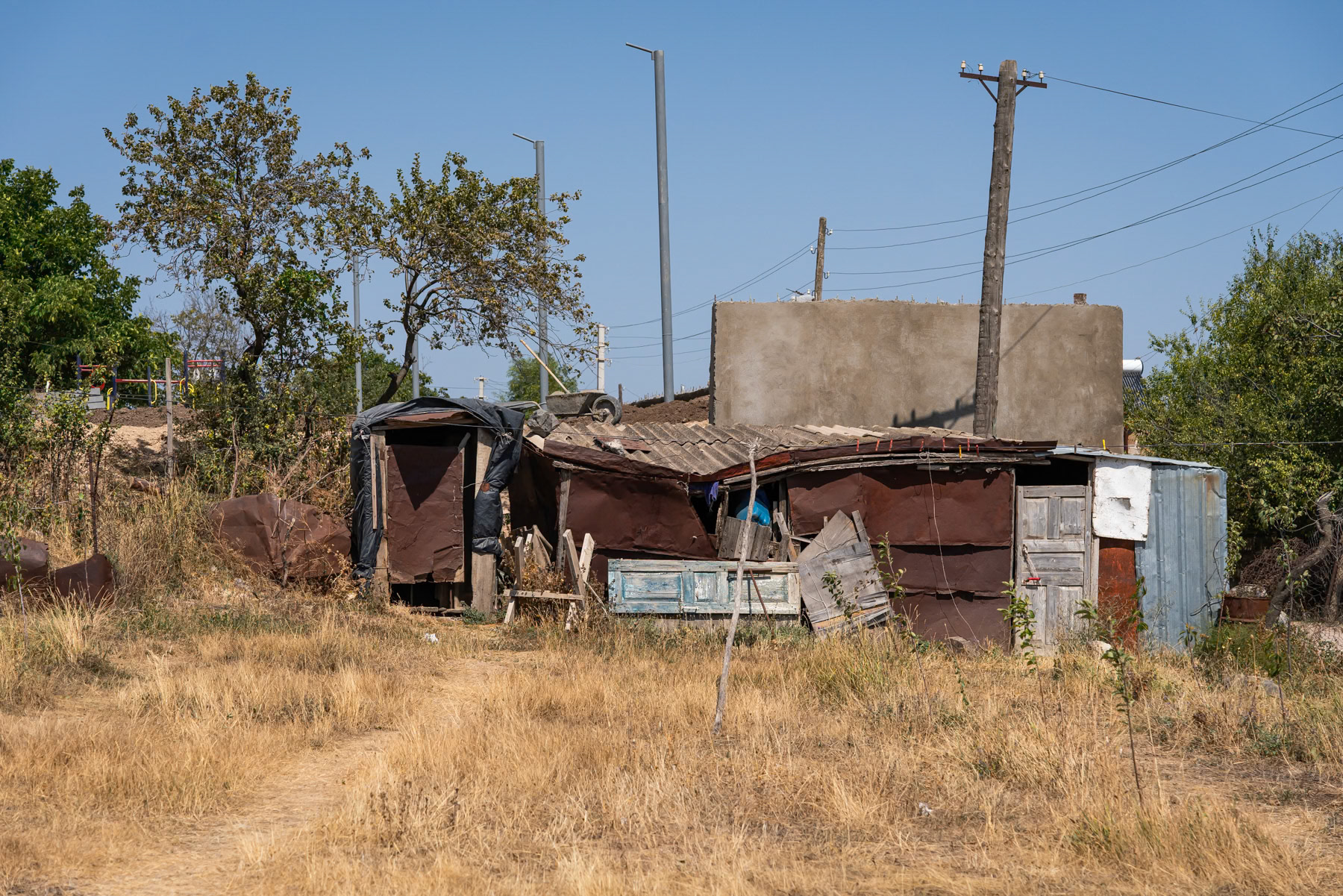 "Domiks," temporary Soviet-era shelters made of sheet metal that are impossible to heat in winter, are still used today by poor families or by people displaced from Nagorno-Karabakh. These individuals lost all their belongings and their homes when they had to flee the region in 2020 and again in 2023. Arabus, Syunik, Armenia, September 2025