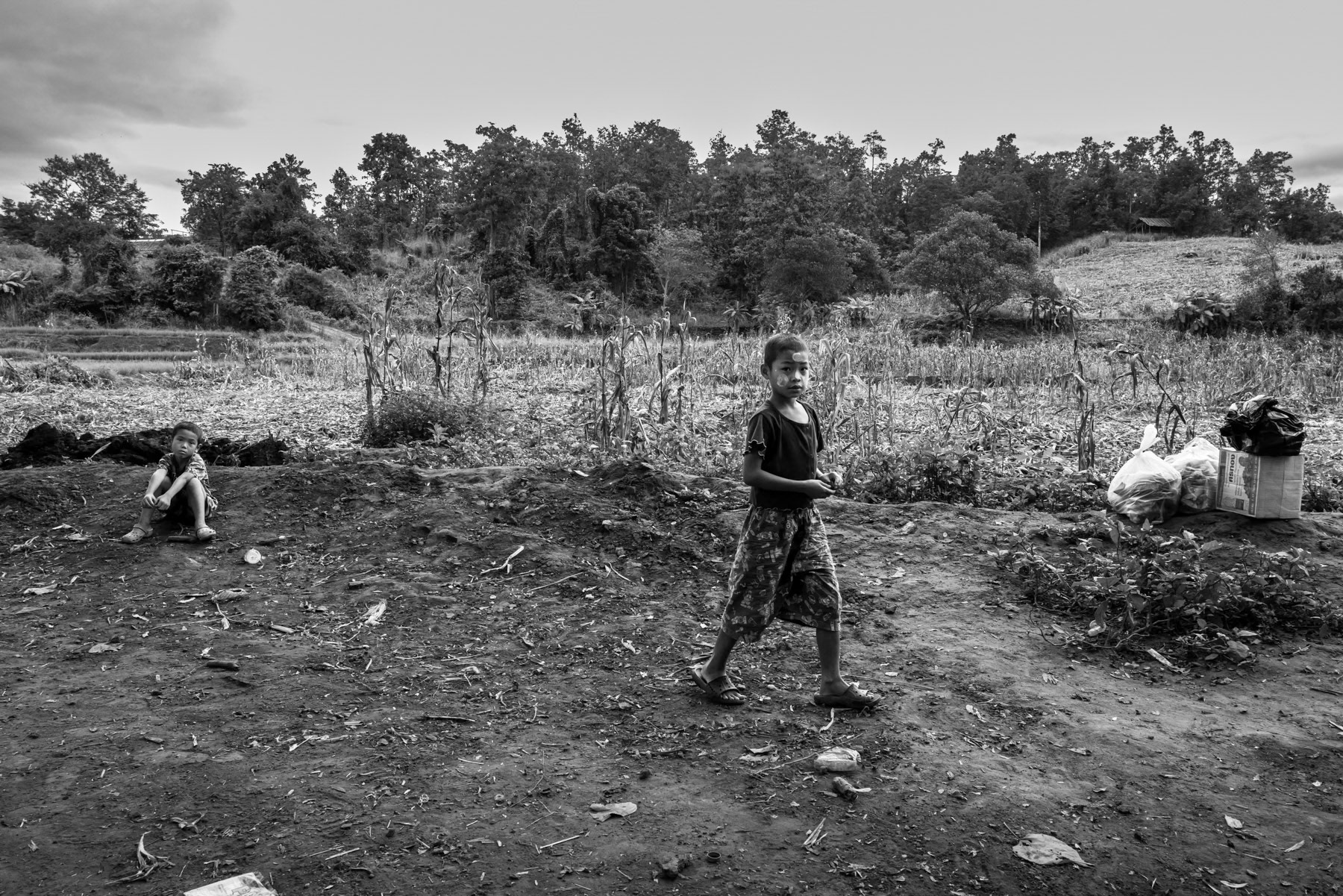 Karen children playing before classes start in a riverside shelter near Thailand that now serves as both home and classroom for displaced Karen children whose villages and schools have been repeatedly bombed by junta forces. Htee Baw Kaw, Karen State, Myanmar, September 2025