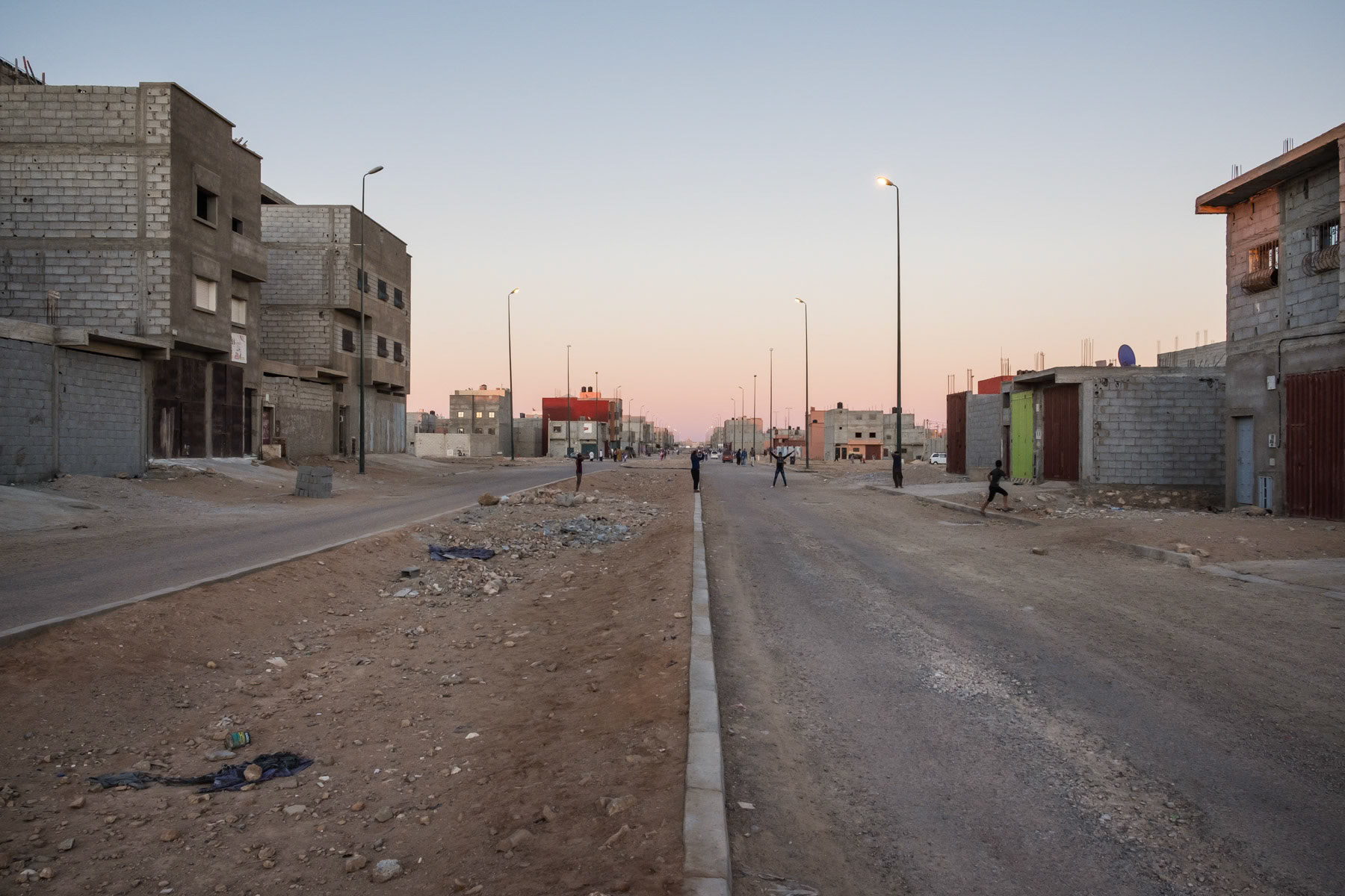 A newly built neighbourhood consisting of merely rudimentary accomodation blocks. The authorities try very hard to attrack Morrocans to settle in the disputed territory of the Western Sahara by building infrastructure and new neighbourhoods on the edge of the capital. Laayoune, Western Sahara, December 2018