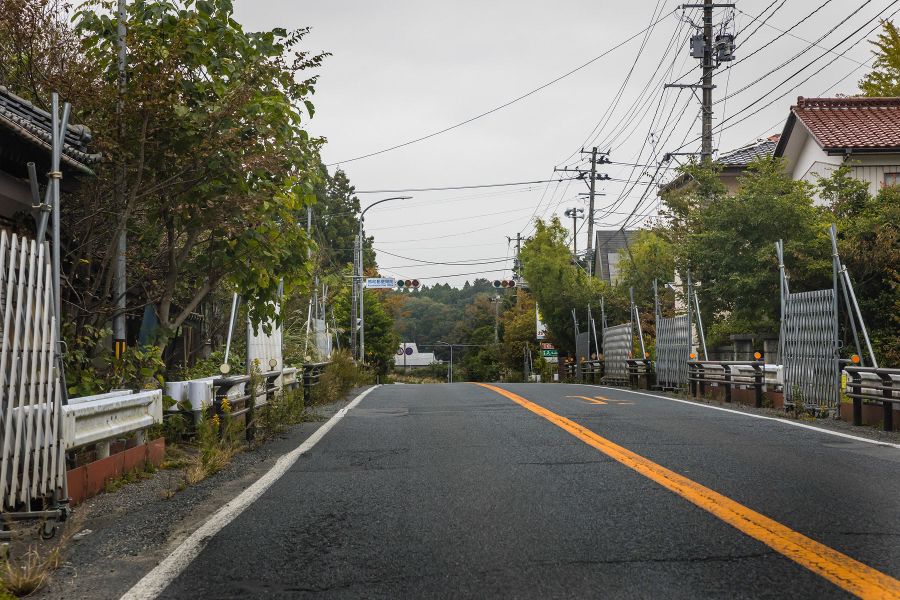 Abandoned houses and buildings along Route 6 that passes through the most affected and contaminated area around the Daichi nuclear power plant. Okuma, Fukushima Prefecture, Japan, October 2019