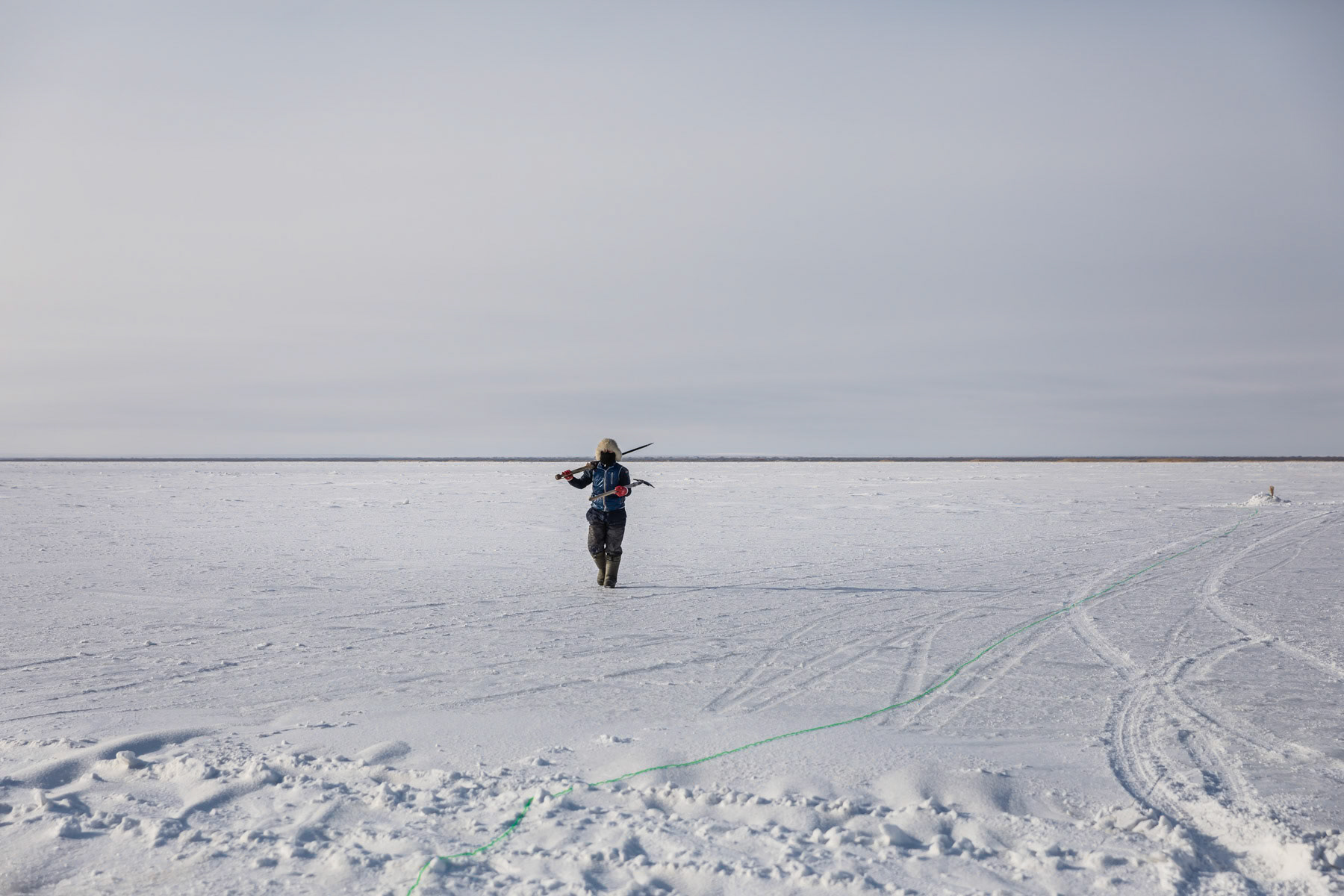 A fisherman heading out to maintain the ice holes. Aral Sea, Kazakhstan, January 2019