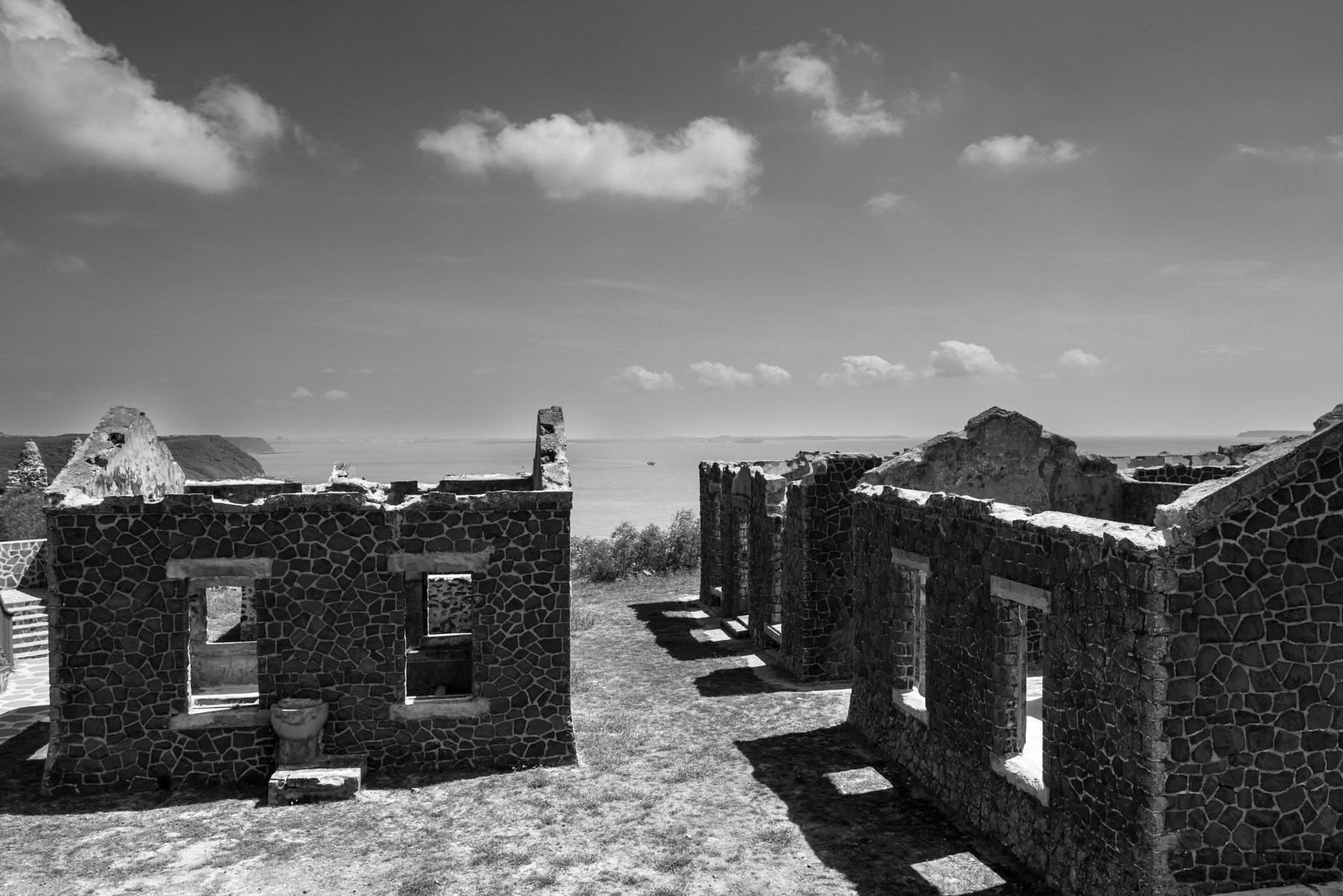 Japanese-era military barracks built from volcanic rock, now abandoned on Penghu Island, Taiwan, October 2025