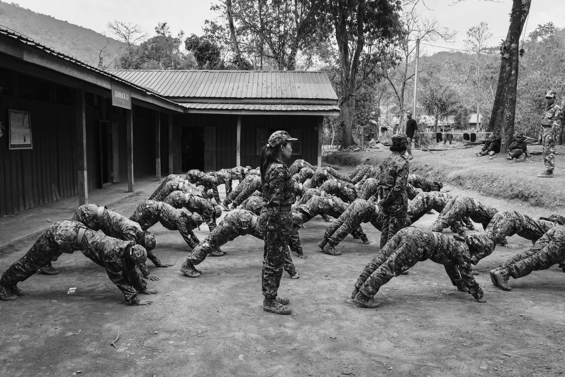 Women new recruits for the Chin National Army (CNA) doing physical exercises during their training before integrating supporting functions within the CNA. Camp Victoria in Chin State, Myanmar, April 2024
