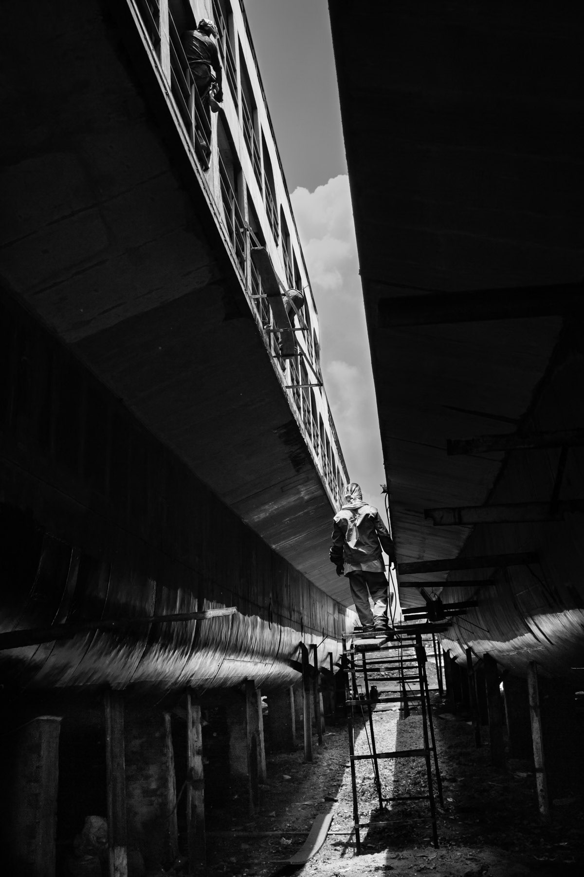 Construction site for ferry boats using recycled parts from the ship-breaking yards. Dhaka ship building yards, Bangladesh, May 2015
